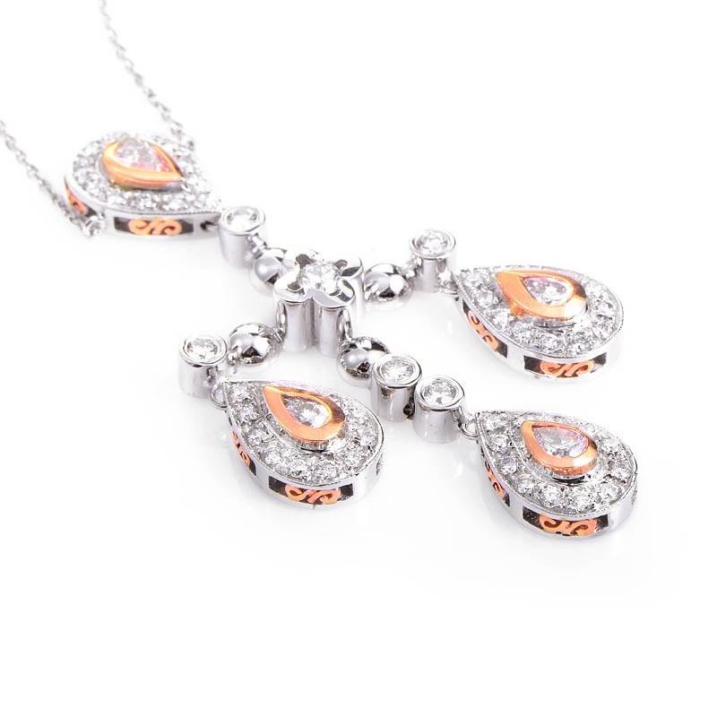This pendant necklace is opulent and shines with diamonds It is made of 18K white and rose gold and boasts a pendant set with ~2.29ct of diamonds.