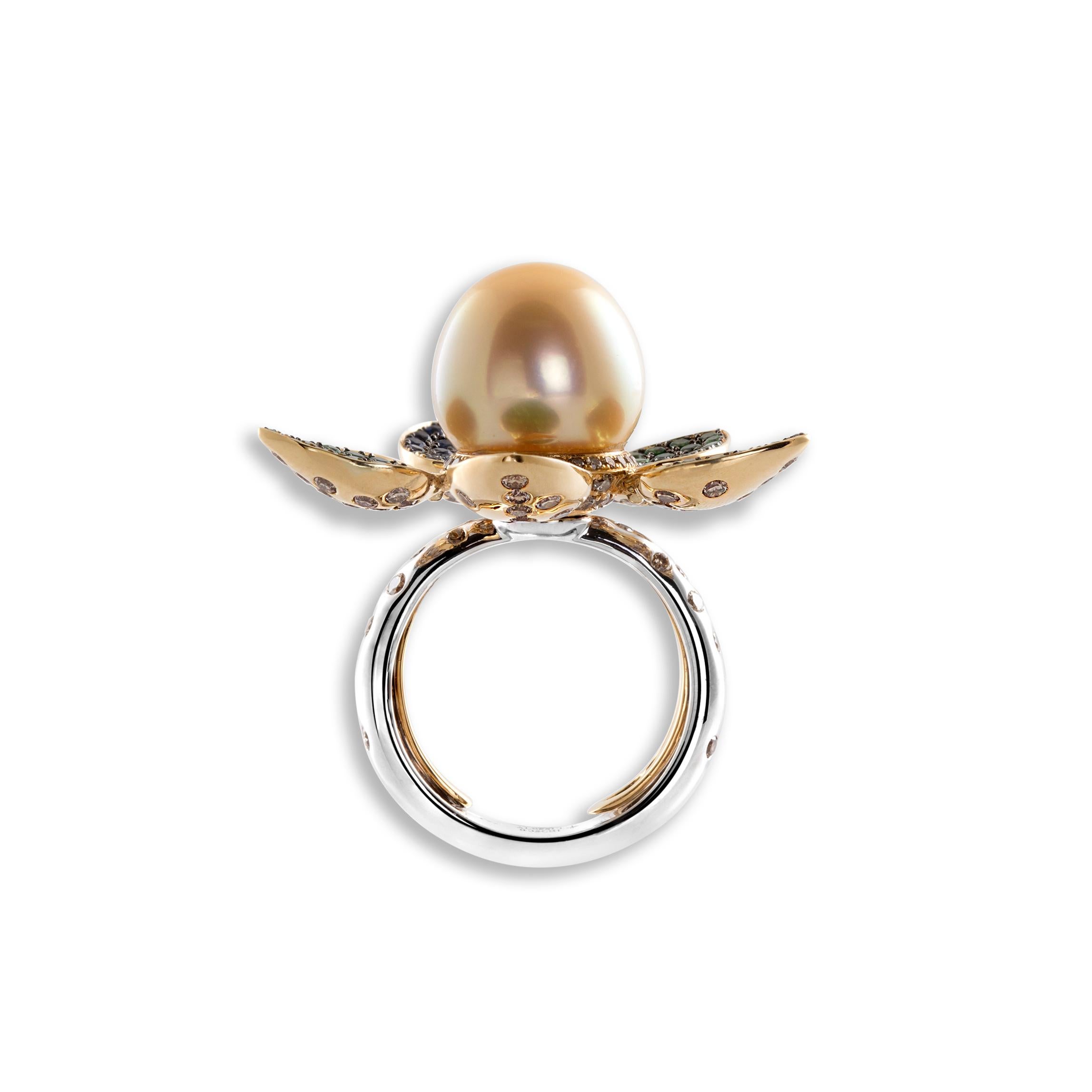 Brown Diamonds 2.29 cts - Blue Sapphires 0.37 cts - Tsavorites 1.53 cts - Golden South Sea Pearl 13.5 mm                                                         

This Ring is inspired by the Lotus plant with its flower crowning a pearl over a long