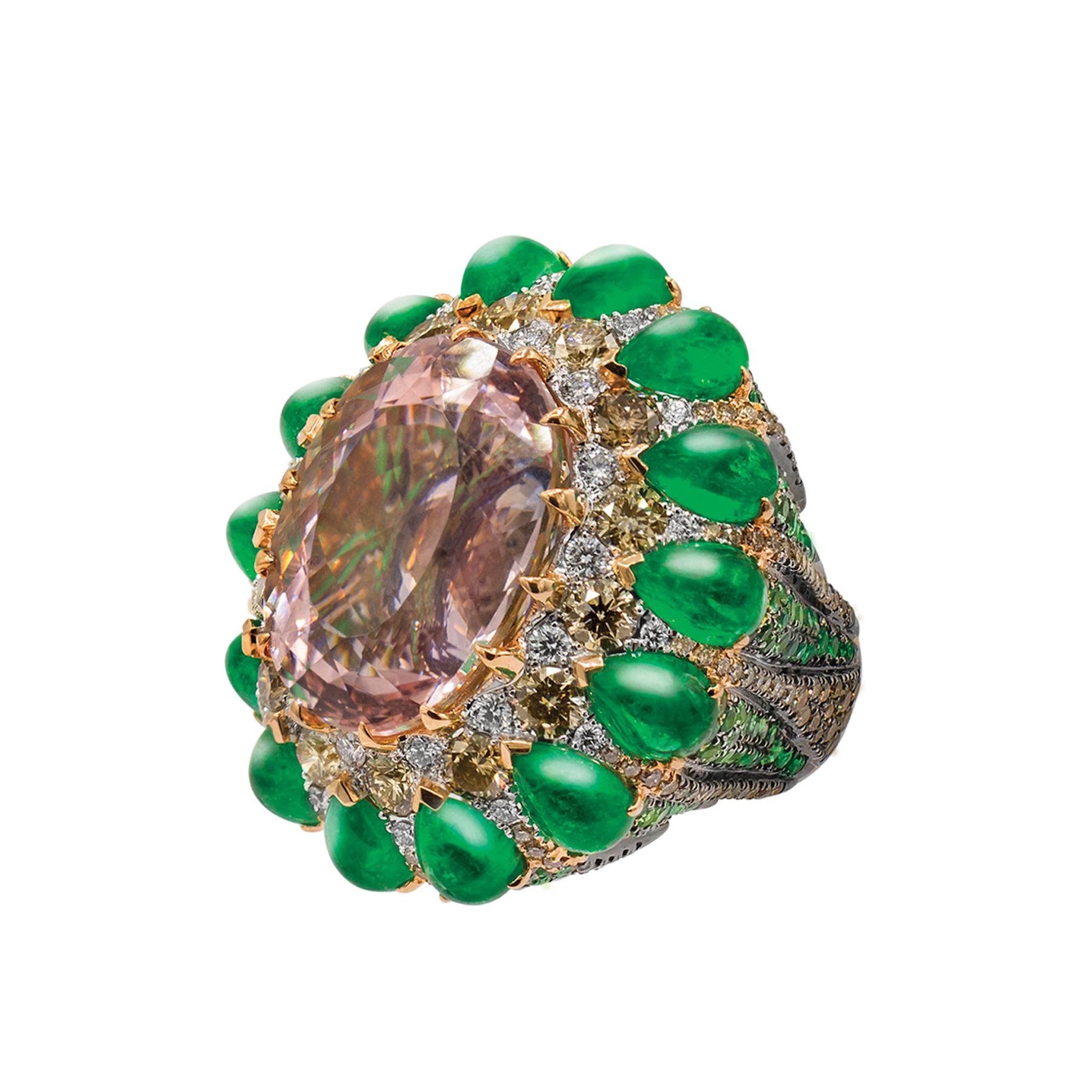 White and Brown Diamonds 3.32 cts, TLB 0.267 cts - Tsavorites 2.35 cts - Aquamarine 0.30 cts - Emeralds Pear Shape 14 pcs 9.07 cts - Morganite 1 pc 22.59 cts         

This remarkable cocktail ring features  emerald pear-shaped tentacles, shaded