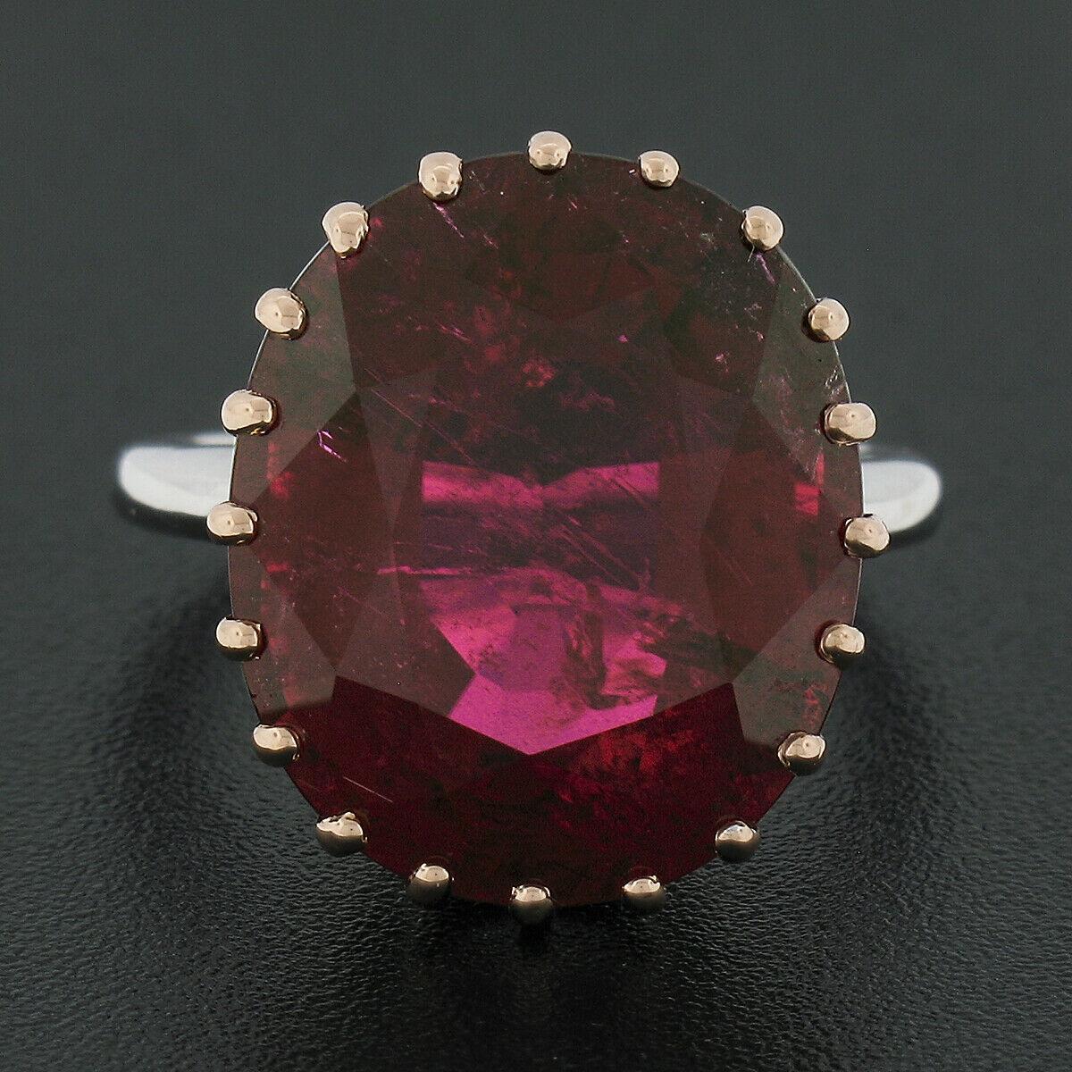 Here we have a truly magnificent, custom made, brand new cocktail ring crafted in solid 18k white and rose gold and features a large and breathtaking rubellite solitaire, multi prong set atop of the fancy rose gold basket. The gorgeous tourmaline
