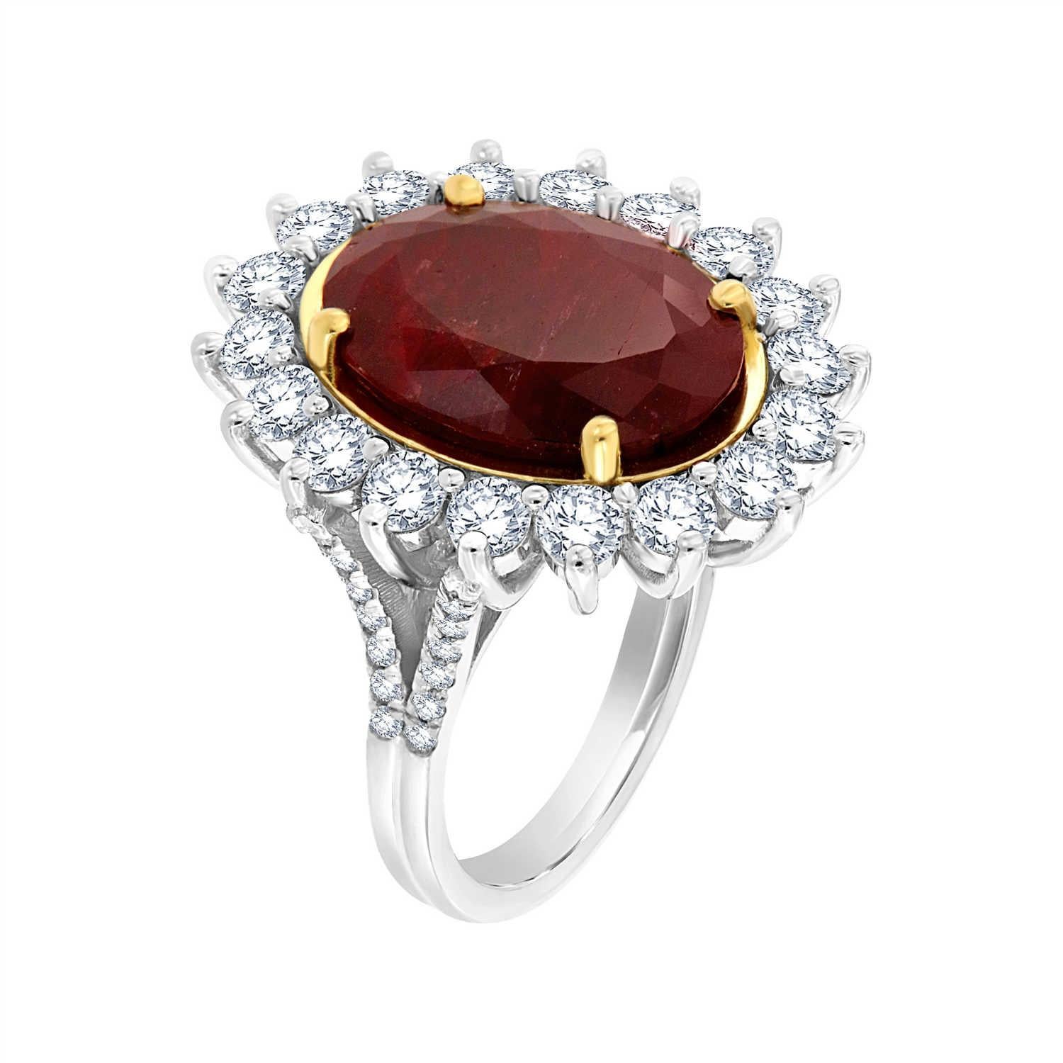This one-of-a-kind ring features a rare un-heated natural 9.67 carat Red Ruby oval shape circled by eighteen (18) brilliant round diamonds and two rows of round diamond micro-prong set on a split shank band. The Ruby is deep red color and has some