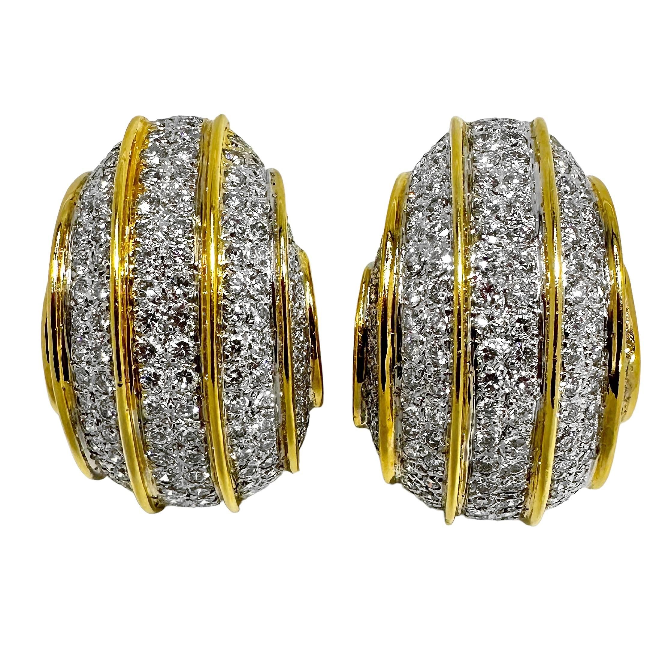 A beautifully constructed and finely finished, vintage pair of large J-hoop 18K gold and diamond earrings. They are set with approximately 500 round brilliant cut diamonds and have a total approximate diamond weight of 10.00ct. Diamonds are of