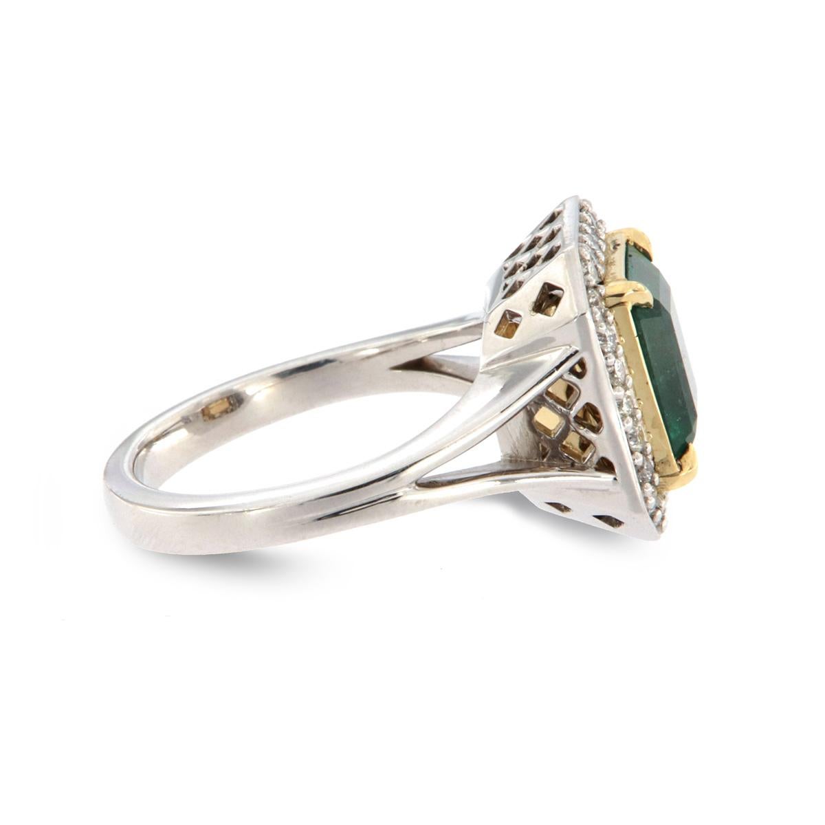 From our signature Sharon collection of exquisite red carpet pieces, this handcrafted ring is centering an Asscher-shaped 4.08 Carat top-quality, vibrant green color Ethiopian Emerald in premium luster. A halo of 26 round brilliant diamonds in