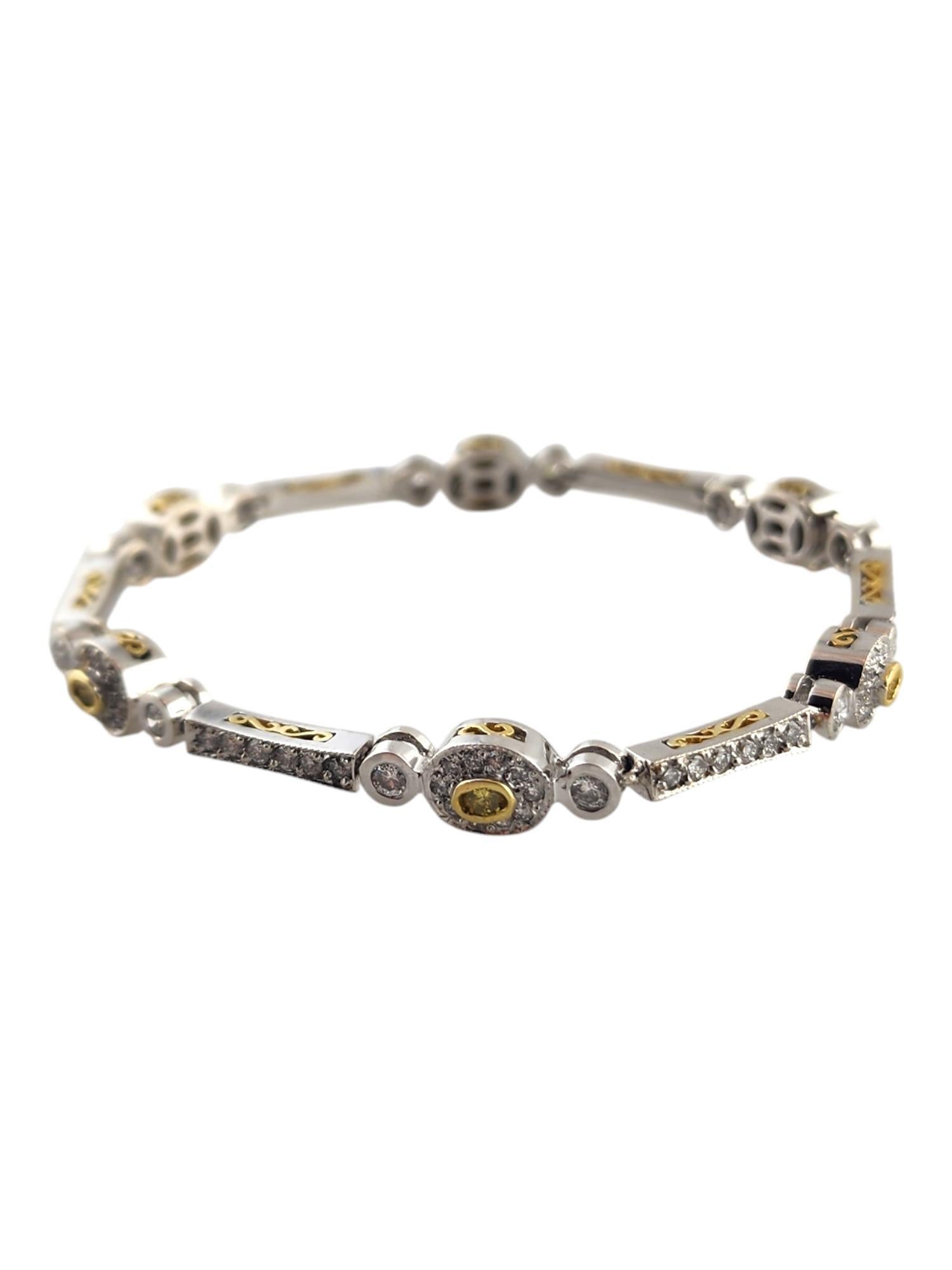18K White & Yellow Gold Yellow & White Diamond Halo Style Pink Bracelet

This gorgeous link bracelet crafted from 18K white and yellow gold features 6 round brilliant cut yellow diamonds as well as 108 sparkling round brilliant cut white