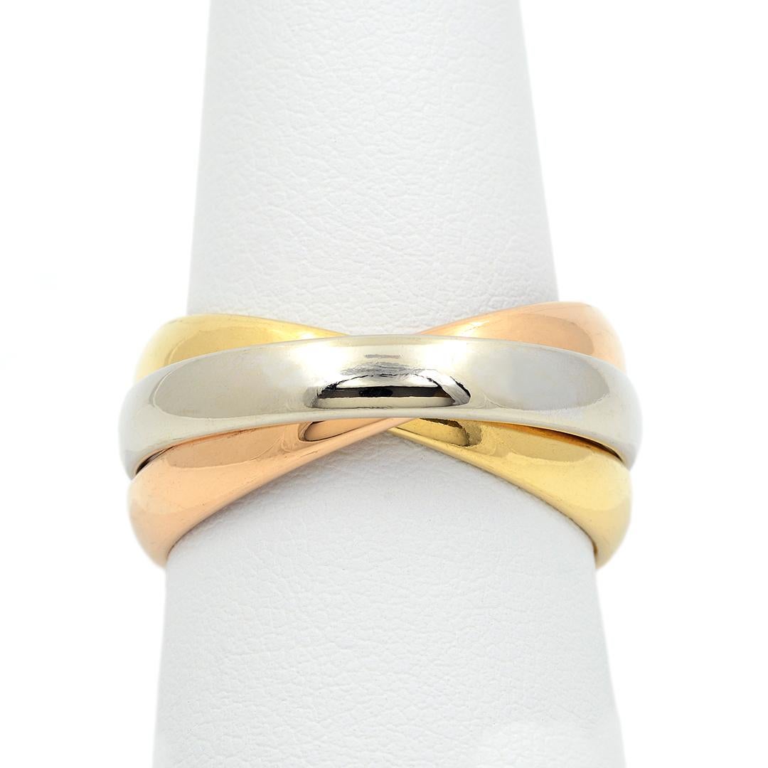 This unique band is made up of three individual interlocking bands of 18k yellow, white, and rose gold, each measuring 4mm wide. The band has a polished finish and is a size 11.25.
- 18k Yellow, White, & Rose Gold
- Polished Finish
- 4mm Wide
- Size