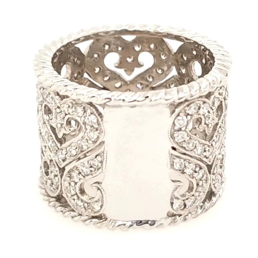 A beautiful wide Diamond barrel ring with a heart motif in 18K White Gold.  Expertly set with Round Brilliant Cut Diamonds weighing 1.22 carat total weight, G-H in color and VS-SI in clarity.  The ring is 5/8 inch in width.  Ring size 6.  9.79 grams.