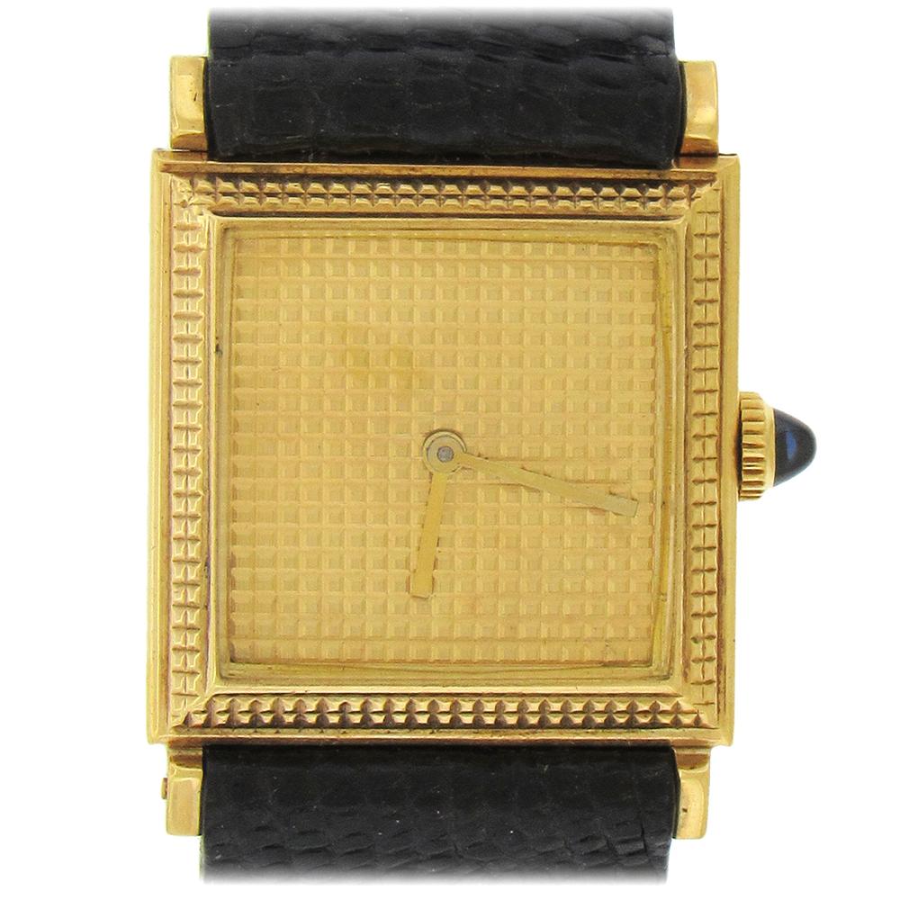 18K yellow gold Swiss Boucheron dress, circa 1980's,  watch is an unusual square woman's wristwatch, with Boucheron's signature one-piece strap and a sliding lug section to open and close the strap. The case measures 21mm x 27mm, with a snap back