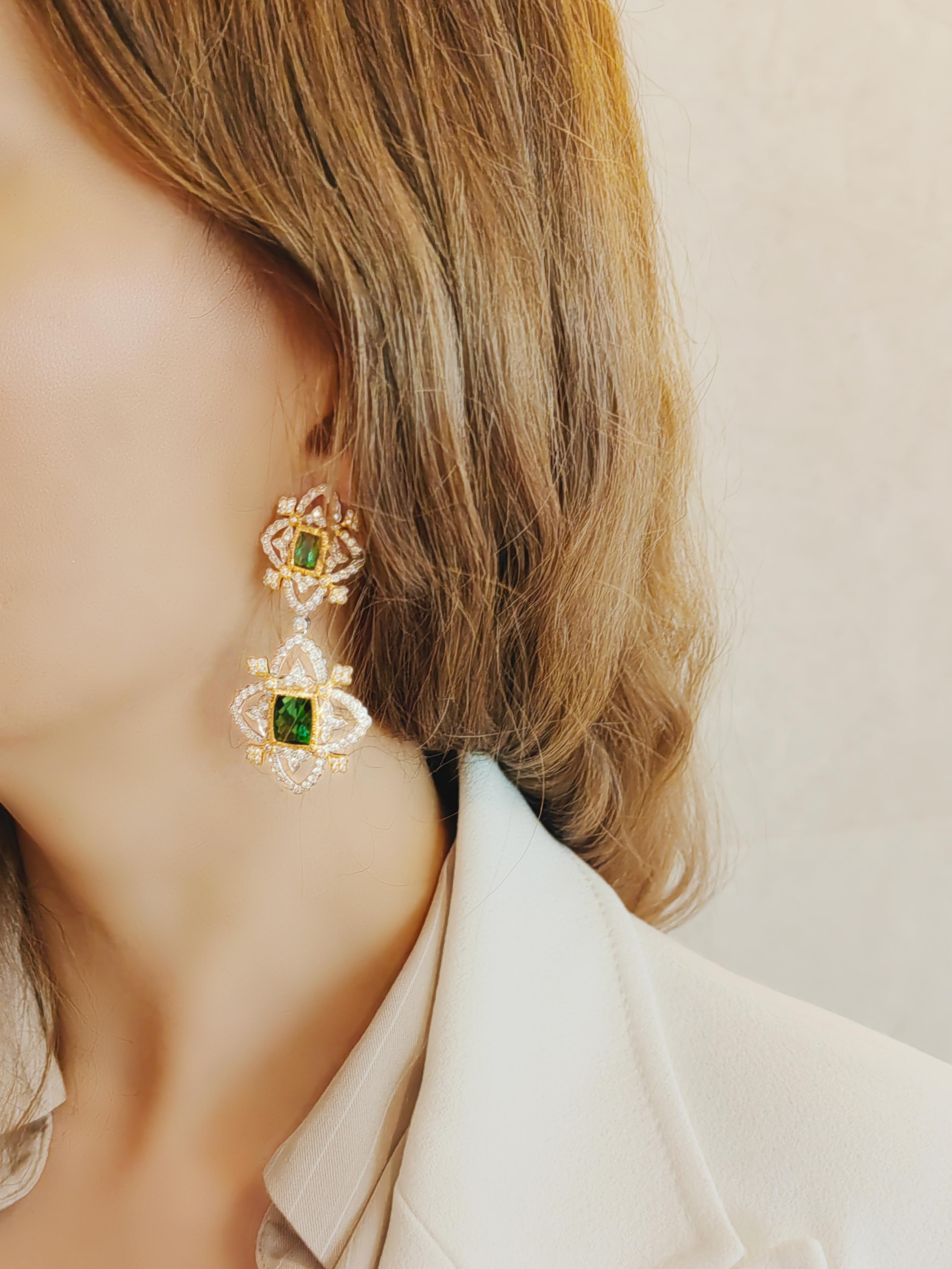 The best kind of statement earrings. These completely authentic earrings are a timeless classic that will age well and be cherished for generations. The unexpected curves, the exquisite cut pair of Afghan tourmalines, the elegantly executed hand
