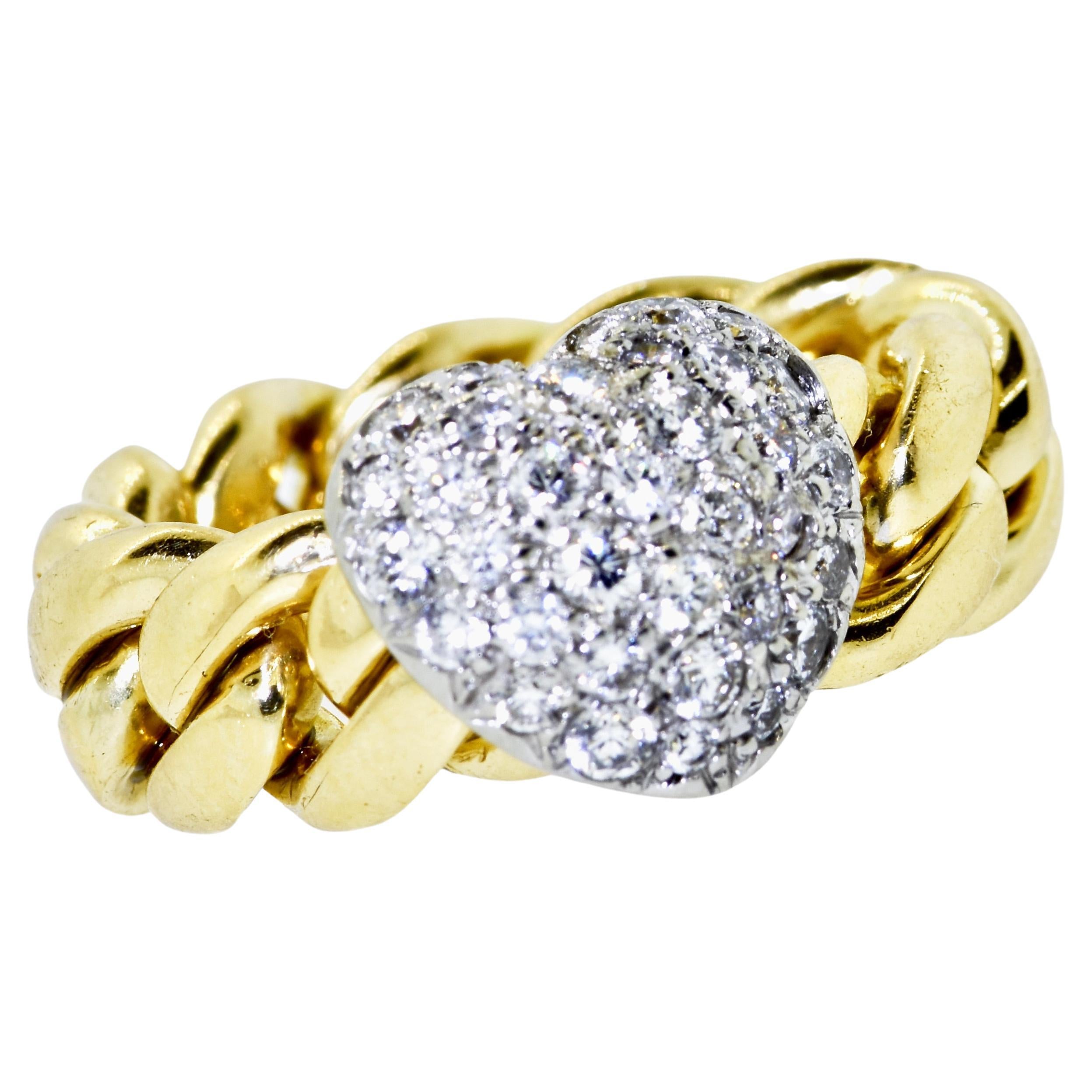 Platinum and 18K yellow gold heart motif unusual ring.  The platinum and diamond pave heart slides along the flexible 18K gold link.  The diamonds are quite nice. Brilliant cut, all well matched and finely cut.  The diamonds are all near colorless H