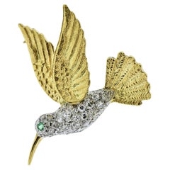 18K Yellow and White gold and Diamond Pave Hummingbird with an Emerald Eye.