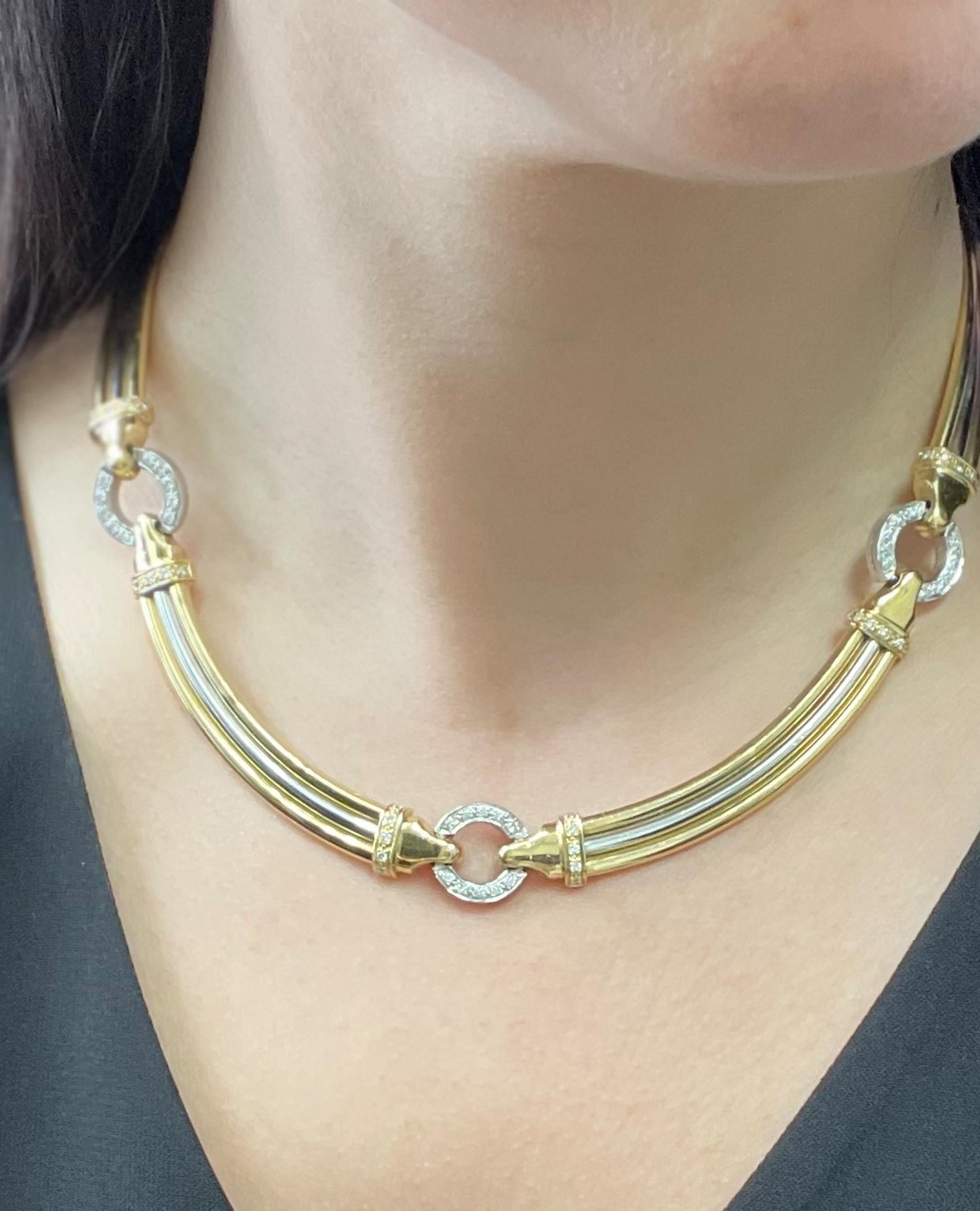 18K yellow and white gold collar necklace with diamonds.  The necklace has three round circles furnished with pave set round, brilliant-cut diamonds.  The necklace has a total diamond weight 1.20 carats.

* 17 inches long
* Diamonds are G color,