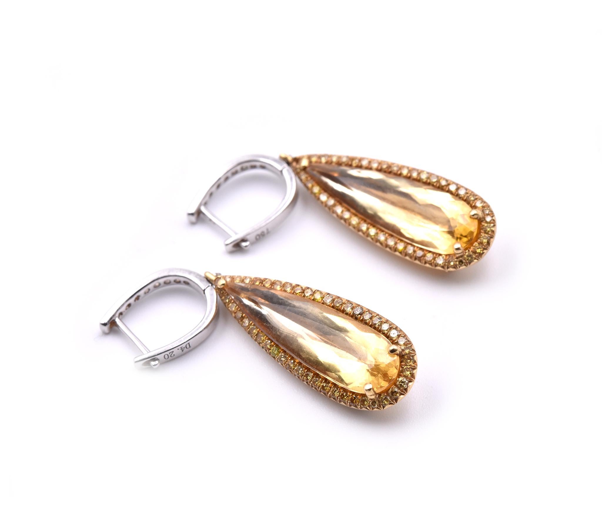 Designer: custom design
Material: 18k yellow and white gold
Diamonds: 106 round brilliant cut= 2.12cttw
Color: G
Clarity: VS
Fastenings: huggie style
Dimensions: earrings are approximately 40.70mm long and 9.86mm wide
Weight: 8.58 grams
