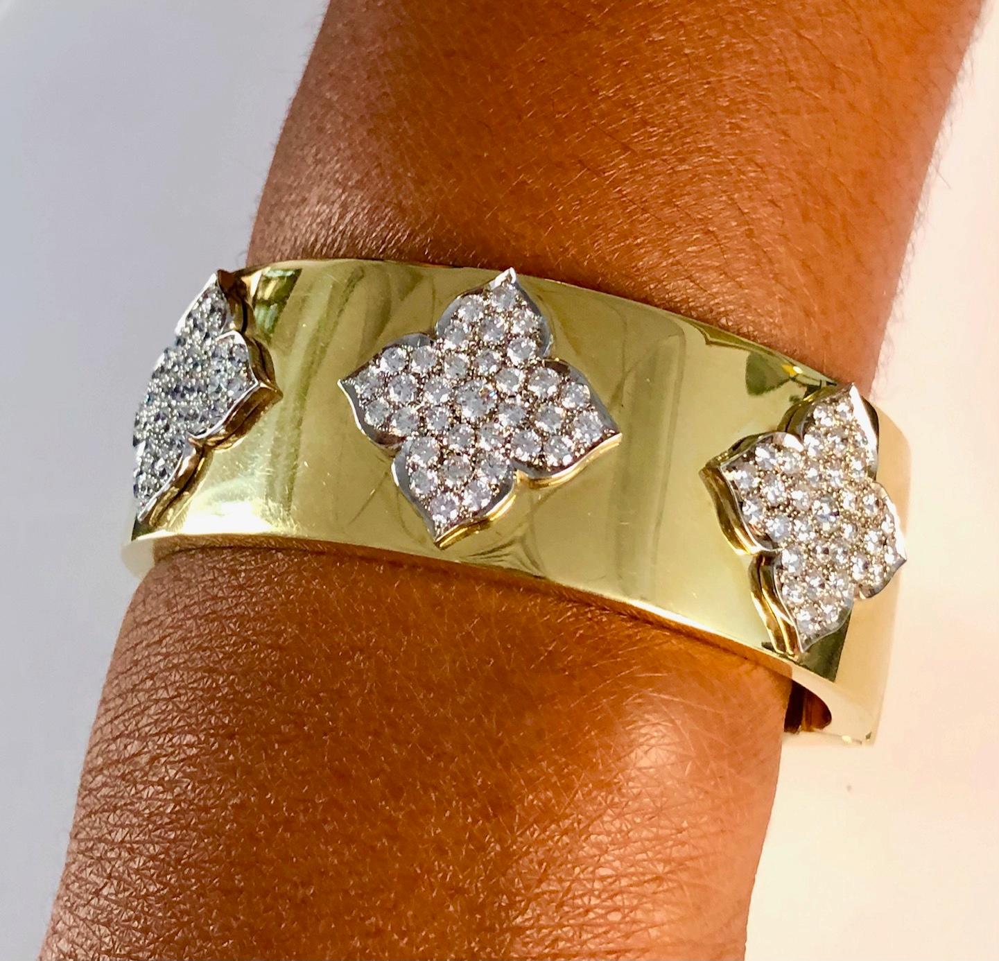 Very wide modern Bangle Bracelet made in 18K Yellow Gold and White gold Diamond crests, set with 99 round Diamonds 4.38 carats. The Bracelet has a push-button clasp to make it easy to open, another unique design feature we implemented with our