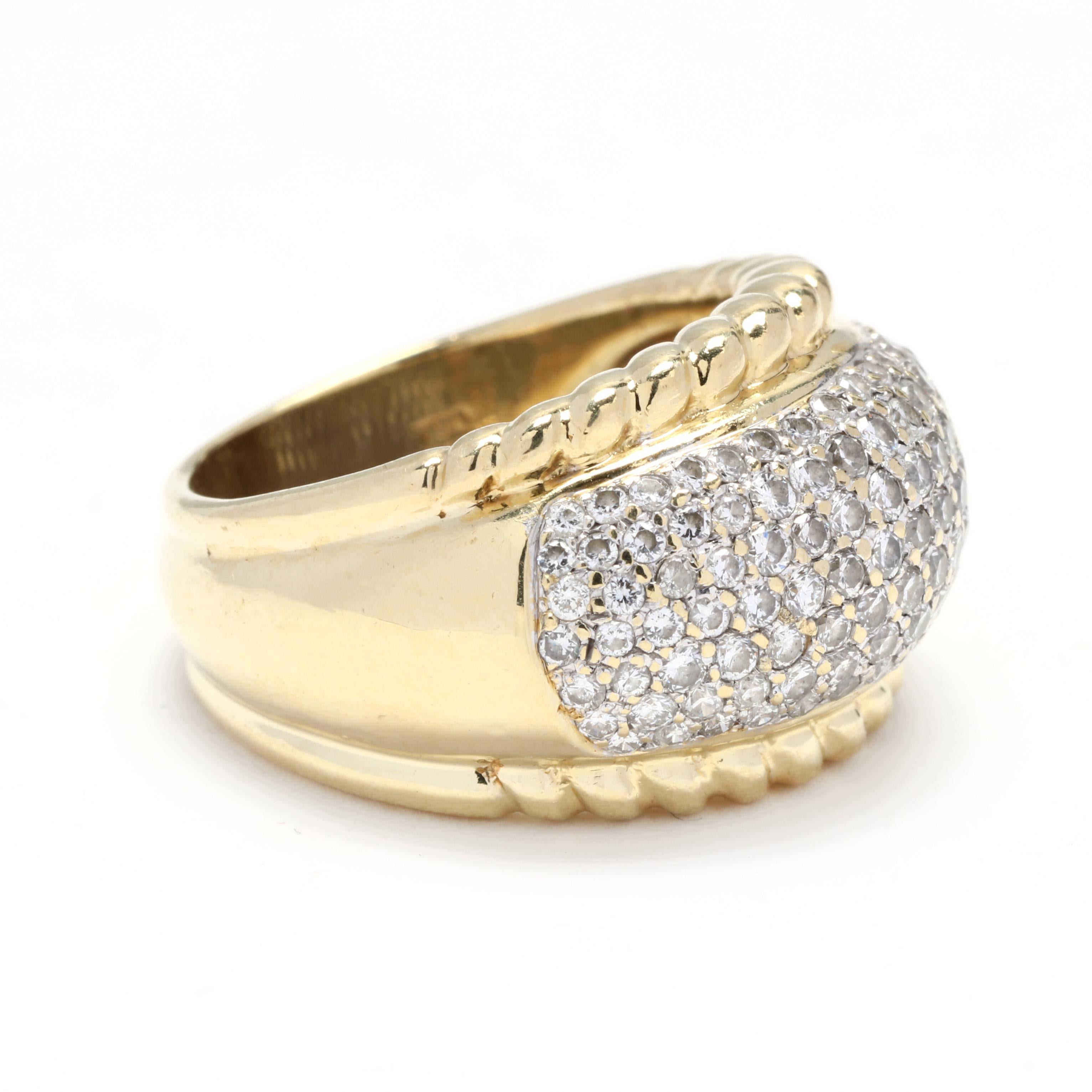 18k yellow and white gold diamond dome ring. An impressive wide diamond band that is domed in the center. The diamonds are set in white gold while the rest of the ring is crafted in yellow gold creating a beautiful color contrast. The edges where