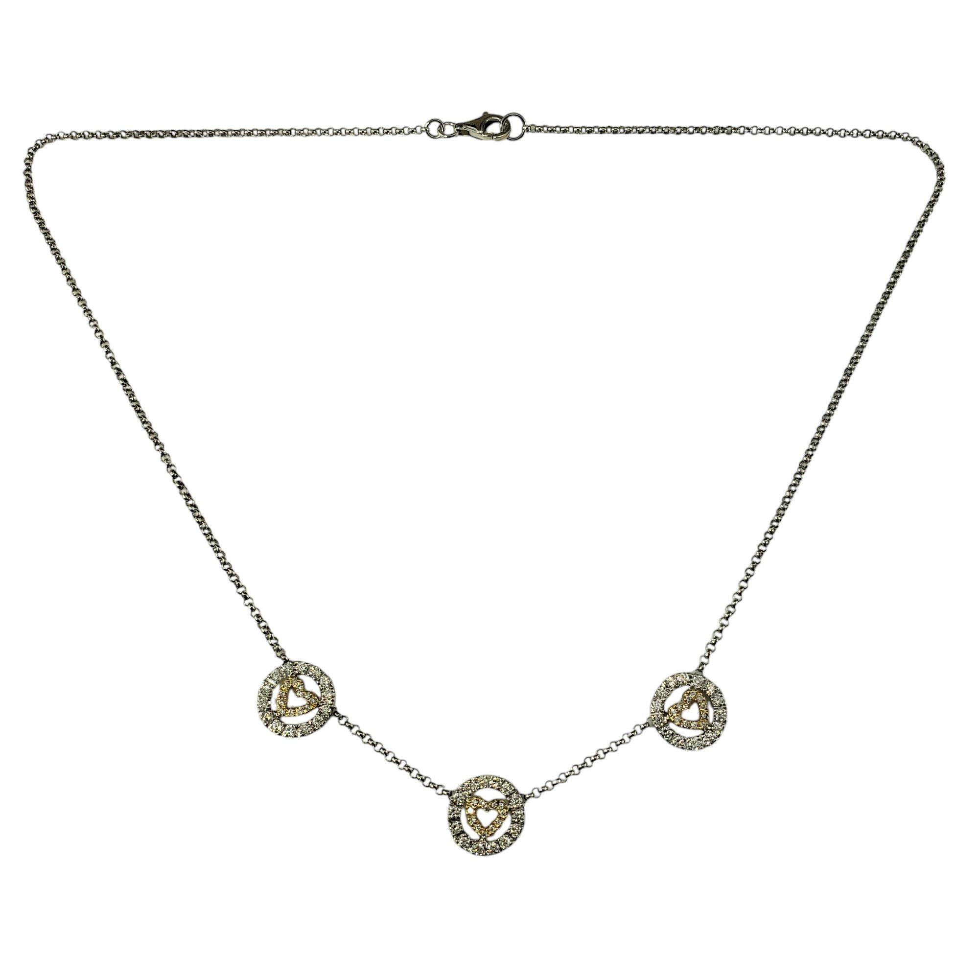 18 Karat Yellow and White Gold Diamond Heart Station Necklace JAGi Certified-

This lovely heart station necklace features 68 round brilliant cut diamonds set in 18K yellow and white gold.  Width: 11 mm.

Approximate total diamond weight:    .72 ct.
