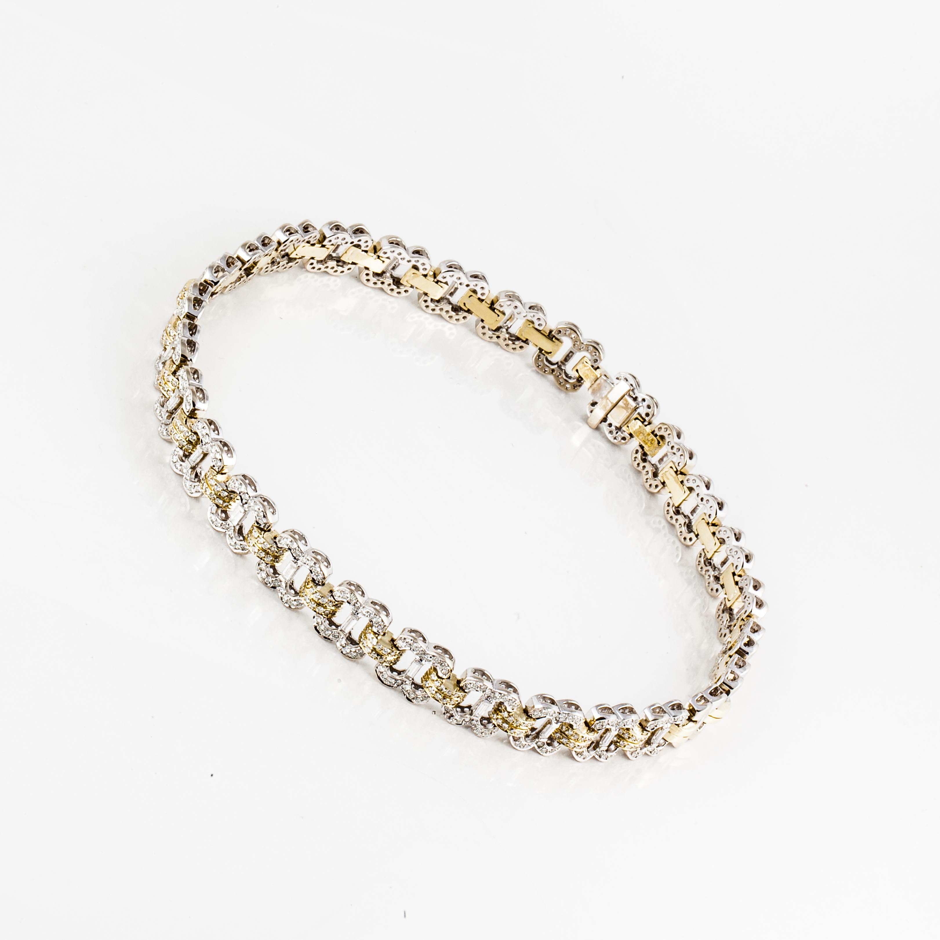 18K two tone necklace in both yellow and white gold with round and baguette diamonds.  The front links are encrusted with round diamonds and each white gold link has a baguette diamond in the center.  Total of 272 round diamonds totaling 5.50 carats