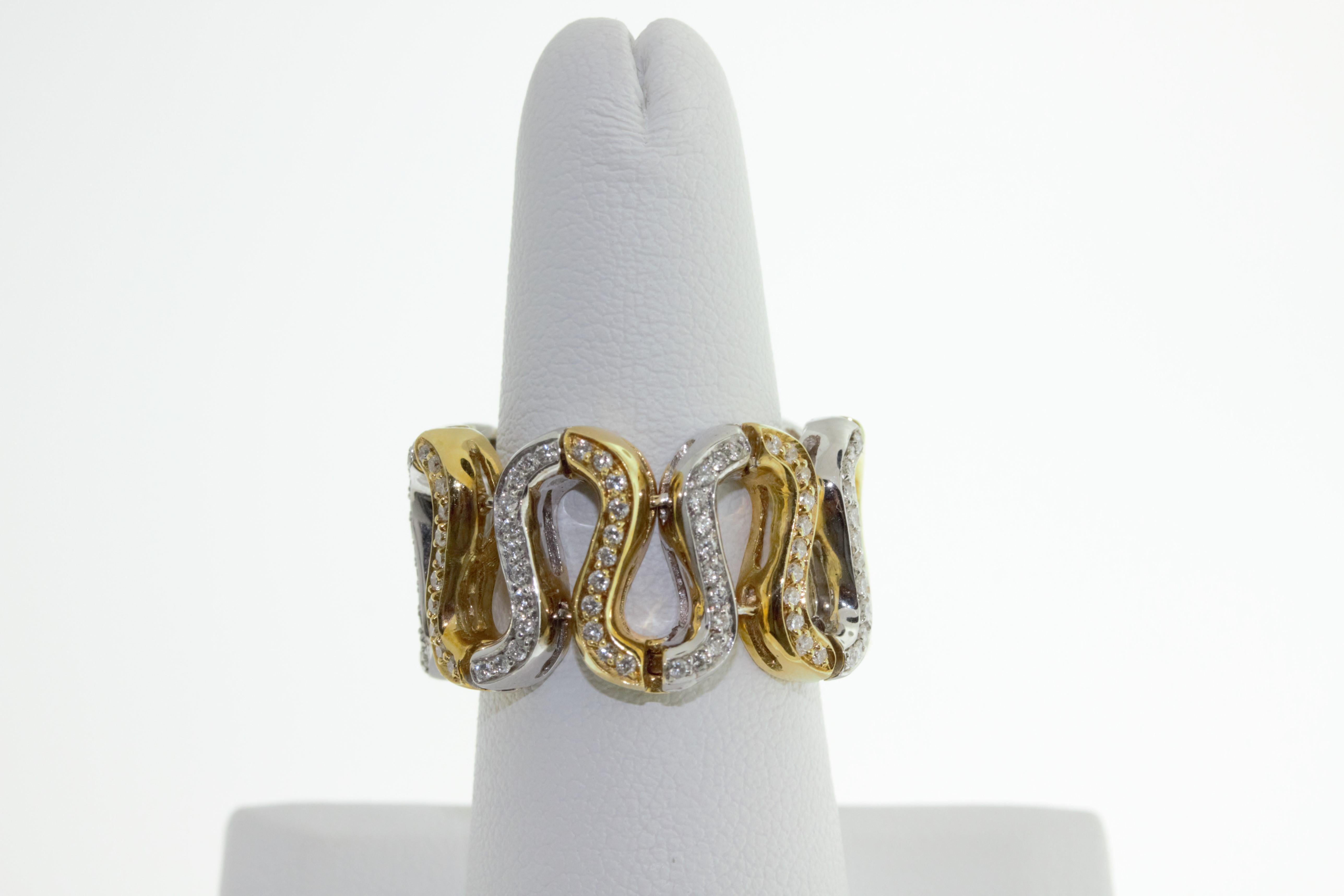 This 18K yellow and white gold ring  features 0.81 carats of round G-H VS diamonds set in a swirl snake pattern. 15 grams of yellow and white gold. Size 8 1/4, ring has stretch. Made in Italy.