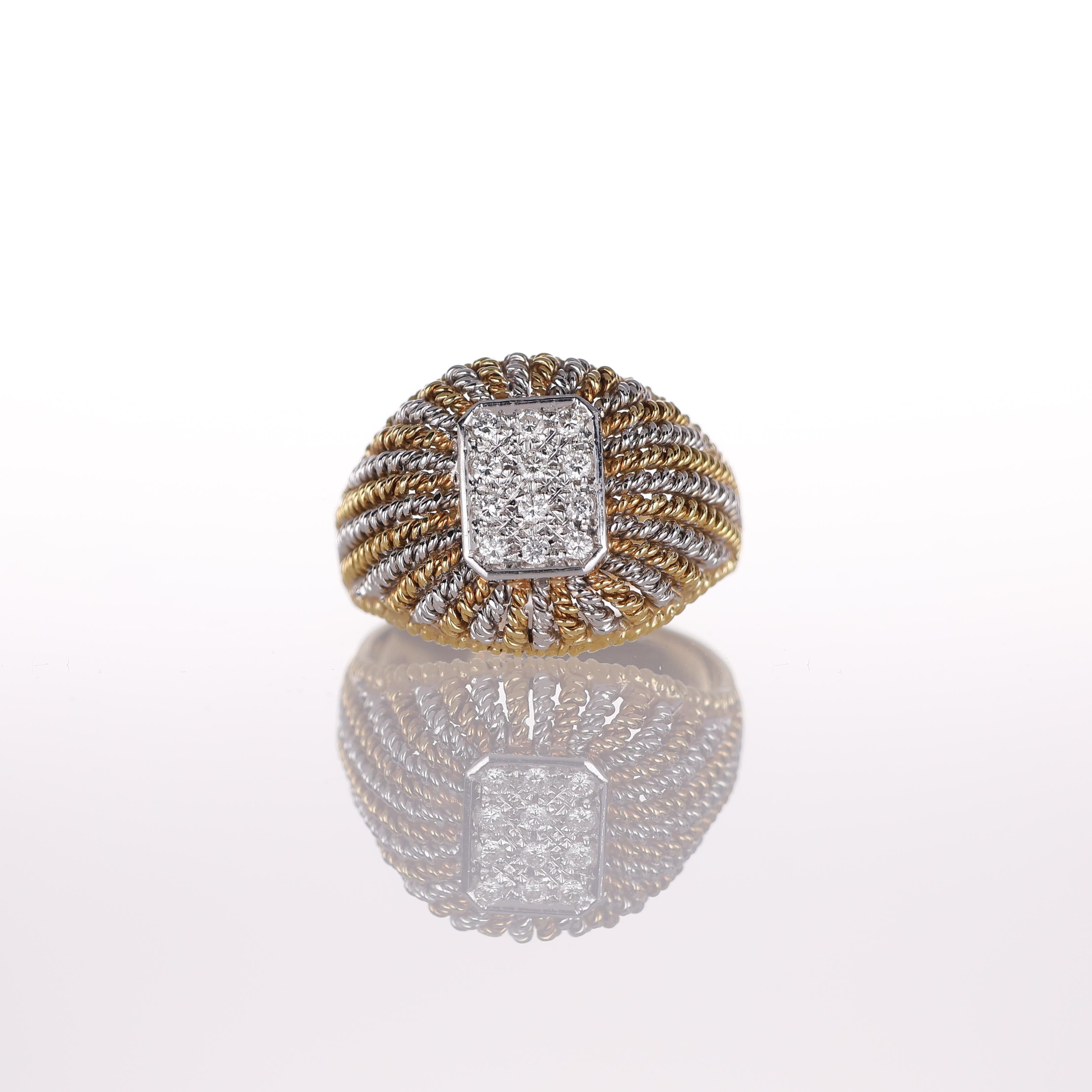 A refined wide band ring crafted in 18K yellow and white gold, featuring intricate filigree detailing and a rectangular pavé-set diamond centerpiece totaling 0.16 carats. The delicate gold wirework enhances the ring’s vintage-inspired aesthetic,