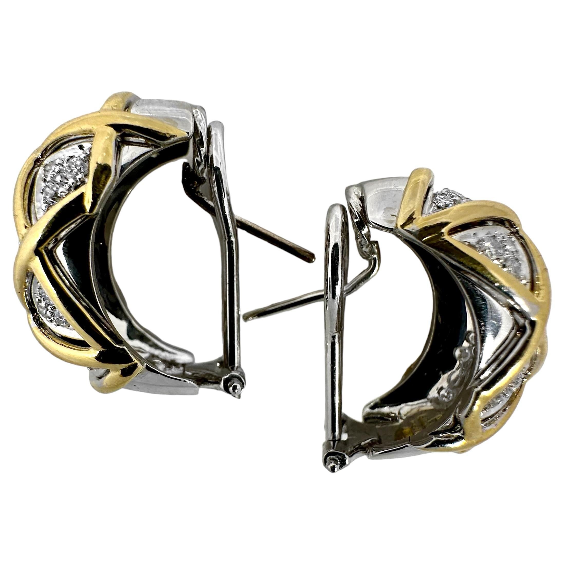This lovely and tasteful pair of 18k yellow and white gold hoop earrings were designed and fabricated by the highly regarded house of Sabbadini in Milan Italy, during the latter part of the 20th Century. Set with a total of 58 brilliant cut diamonds