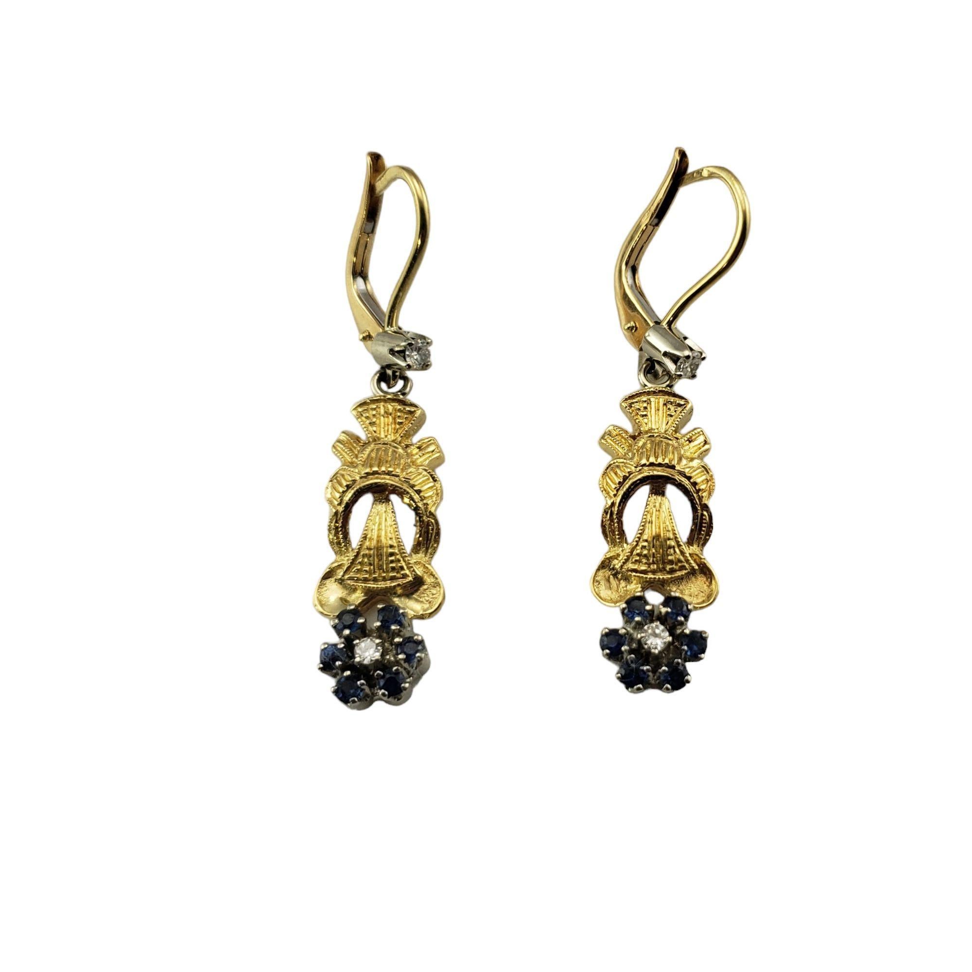 18 Karat Yellow and White Gold Sapphire and Diamond Dangle Earrings JAGi Certified-

These elegant drop earrings each feature six round blue sapphires and two round brilliant cut diamonds set in beautifully detailed 18K yellow and white