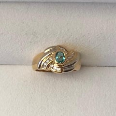 0.40 Carat Emerald and 0.20 Carat Diamonds Engagement Ring on 18 Karat Gold