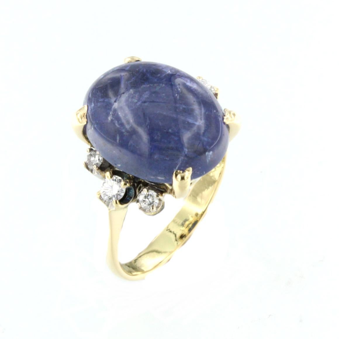 Bague en or jaune et blanc 18 carats avec tanzanite et diamants blancs Unisexe en vente