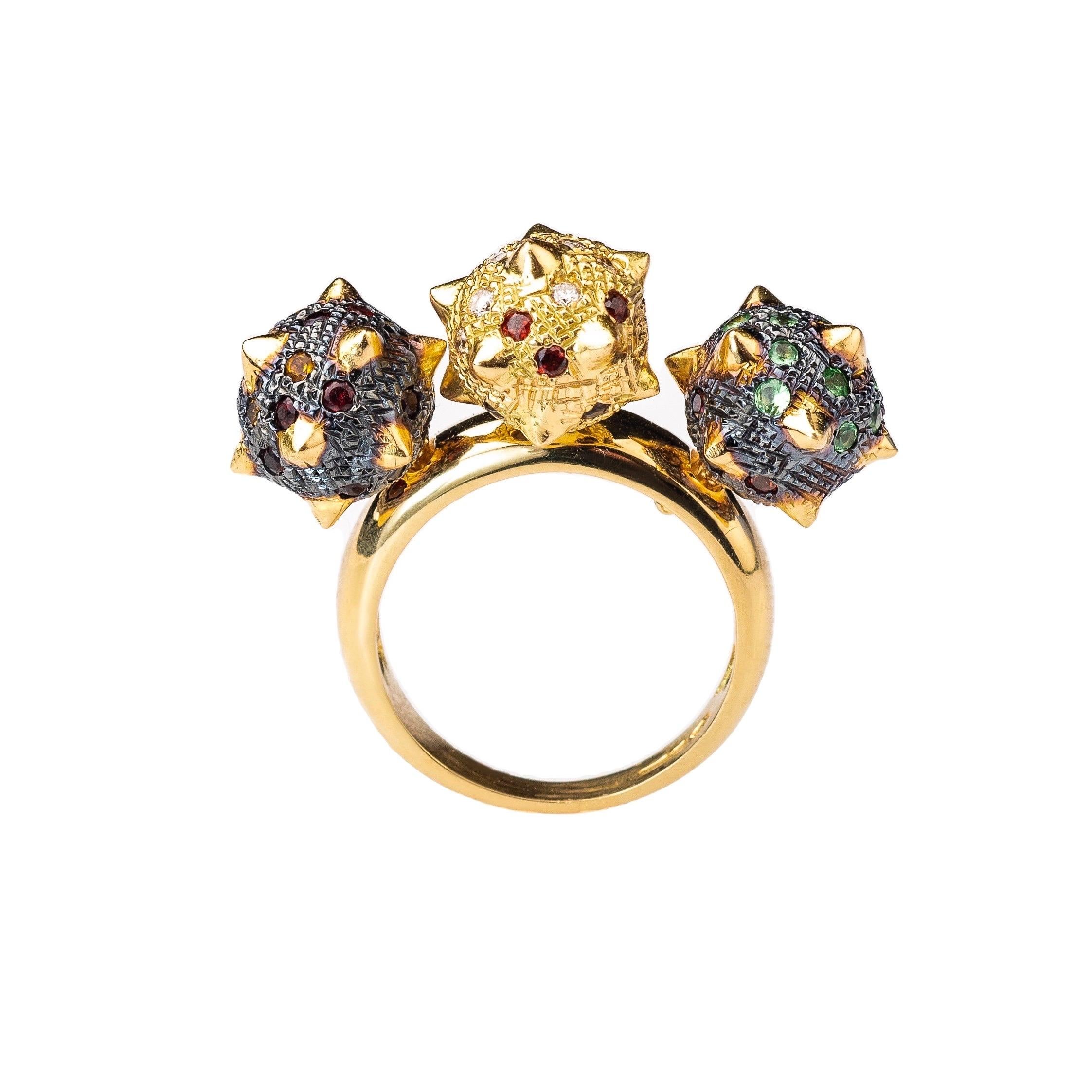 The ‘Rocking Morning Star’, ring is crafted in 18k yellow and blackened gold hallmarked in Cyprus. This impressive, statement ring consists of three individual morning star, spheres fixed on a half round band, in a way that allows a discreet rocking
