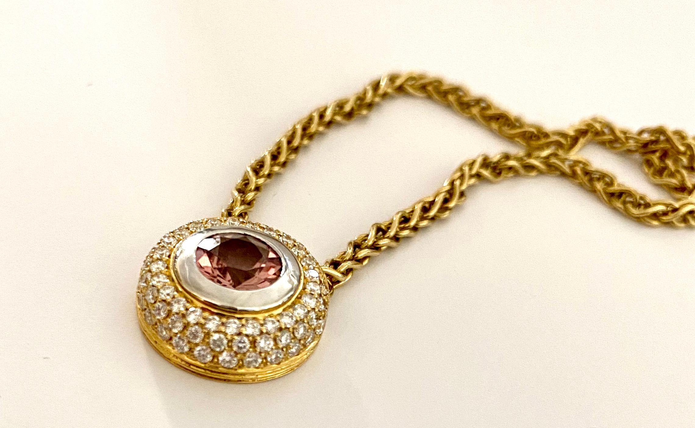 - 18K. yellow gold pendant (white gold setting) with a pink tourmaline (Rubelite) 1.80 ct.
- 66 brilliant cut diamonds weighting: 0.55 ct. VS f-G
- 18K. yellow gold braided round necklace, length 50 cm, weight: 14.13 grams
- Germany ca 1990