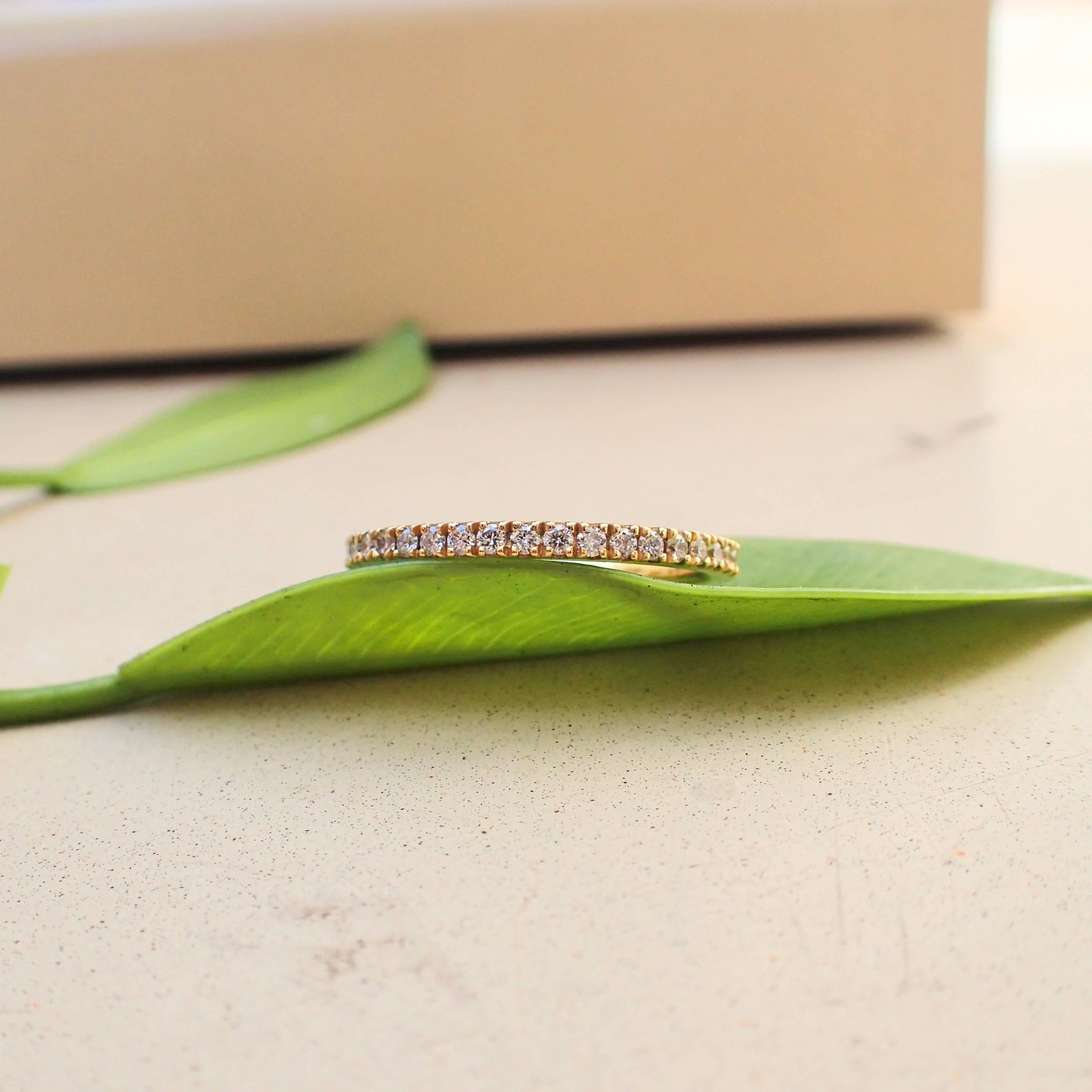 18k yellow gold eternity band is set with forty (40) Round Brilliant Cut diamonds that measure 1.3mm and weigh a total of 0.40 carats with Clarity Grade VS and Color Grade G. The ring is a size 6 1/2 and weighs 1.7 grams (1 pennyweight).

At By