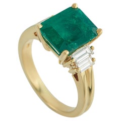 Anello in oro giallo 18 carati con diamante e smeraldo da 0,05 carati MF31-030326