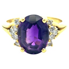 18k Yellow Gold 0.25 ctw Diamond and Oval Amethyst Ring