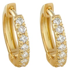 Boucles d
oreilles Huggie en or jaune 18K avec 0,28 ct de diamant PS19-111925