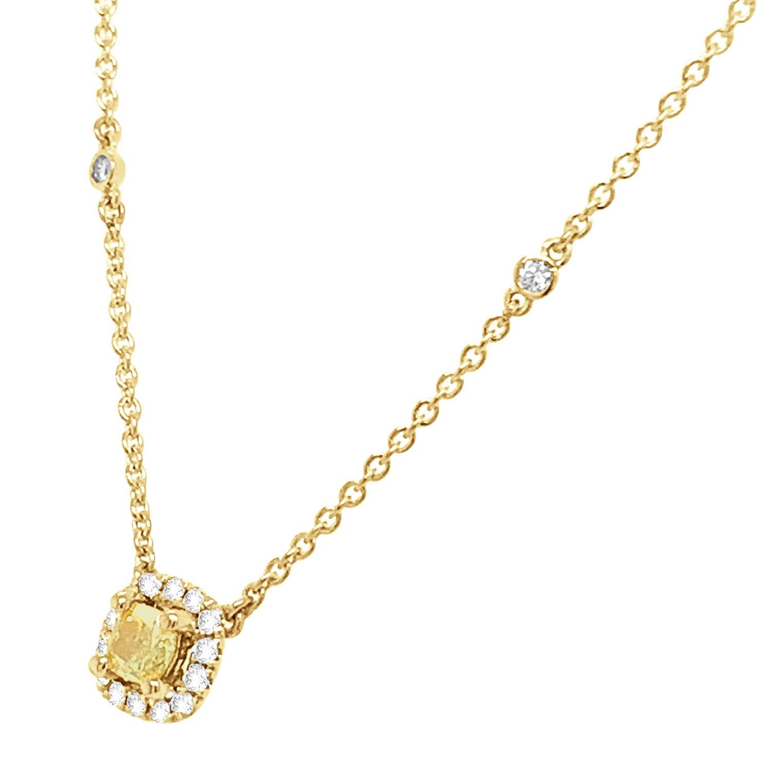 This stunning 18k yellow gold necklace features a 0.31 Carat Yellow Elongated cushion-shaped diamond encircled by one row of brilliant round diamonds on a 1 mm station chain containing sixteen (16) round brilliant diamonds bezel set.
The chain is 18