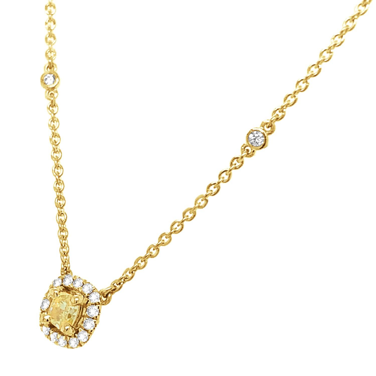 This stunning 18k yellow gold necklace features a 0.31 Carat Yellow Elongated cushion-shaped diamond encircled by one row of brilliant round diamonds on a 1 mm station chain containing sixteen (16) round brilliant diamonds bezel set.
The chain is 18