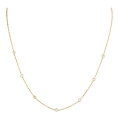 Collar de oro amarillo de 18 quilates con estación de diamantes de 0,75 ct ANK-17469-Y
