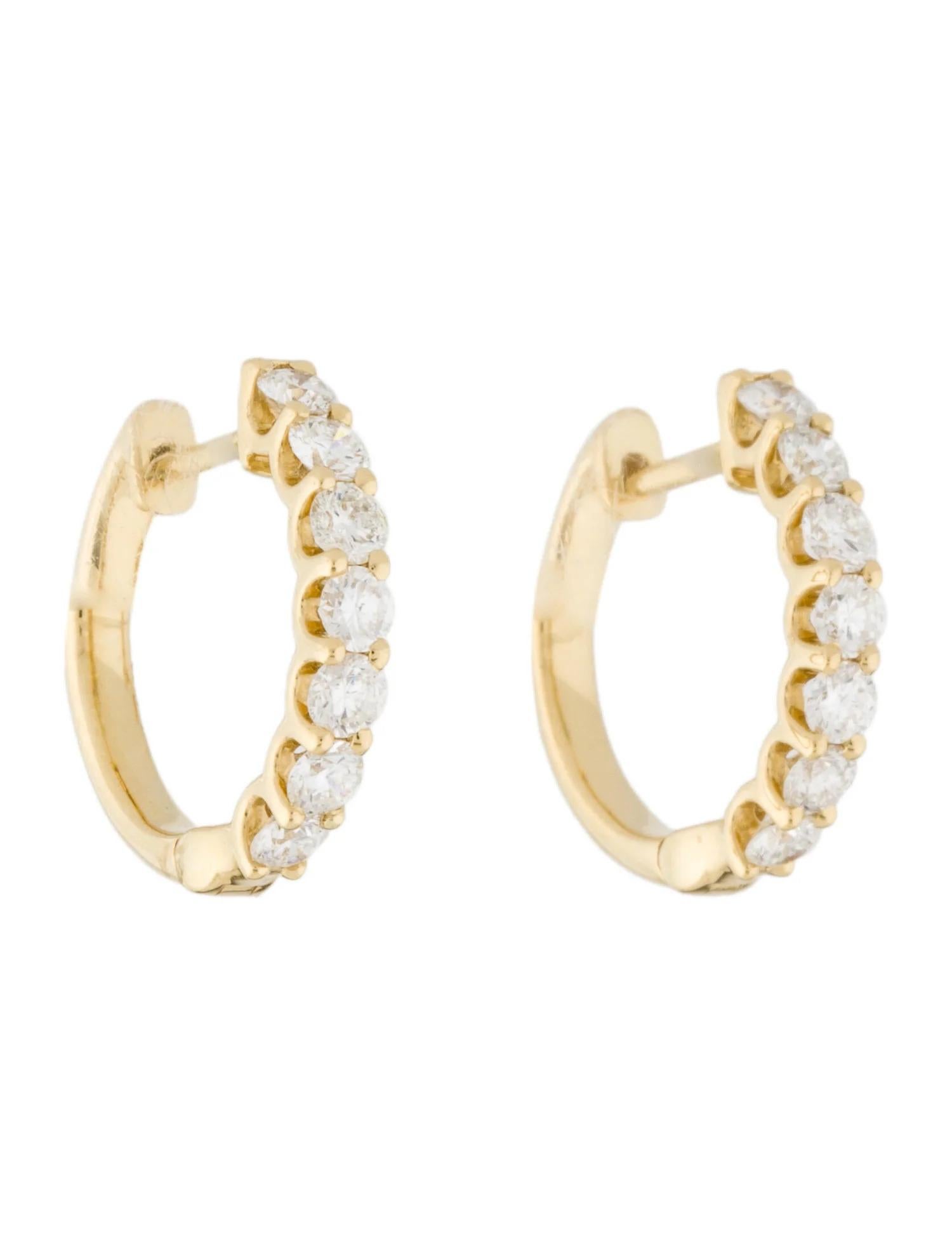 Give any outfit a glamorous flair with this pair of brilliant small thin hoop earrings from the Joelle Collection Encrusted with 0.80ct of exquisite round-cut white diamonds, these earrings add a playful sparkle to any look. The high polish 14k gold