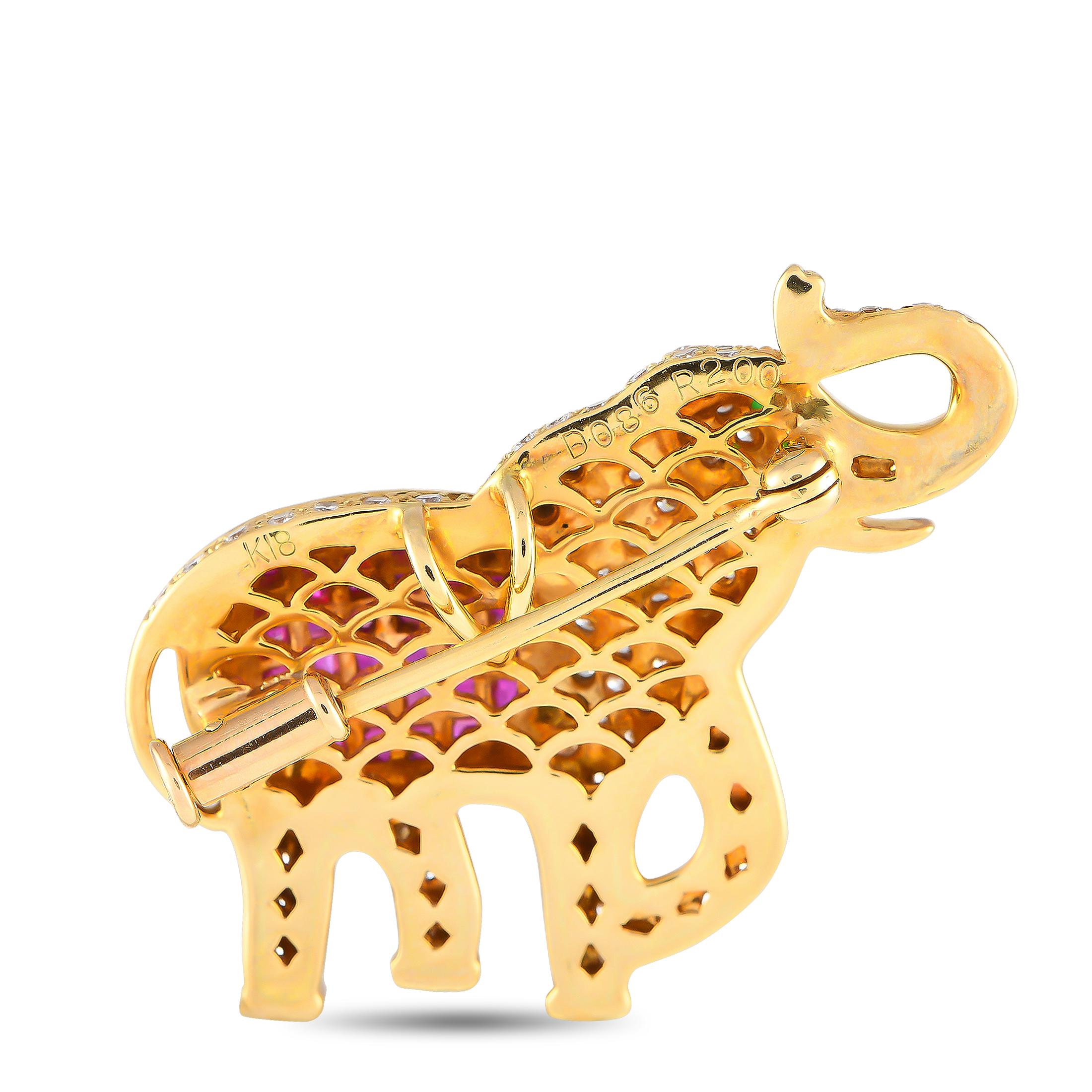 Attract good fortune and good luck with this diamond and ruby elephant brooch. This whimsical accessory is fashioned in 18K yellow gold and is fully covered with round brilliant diamonds. A cushion-shaped bezel on the elephant's body features 2.0