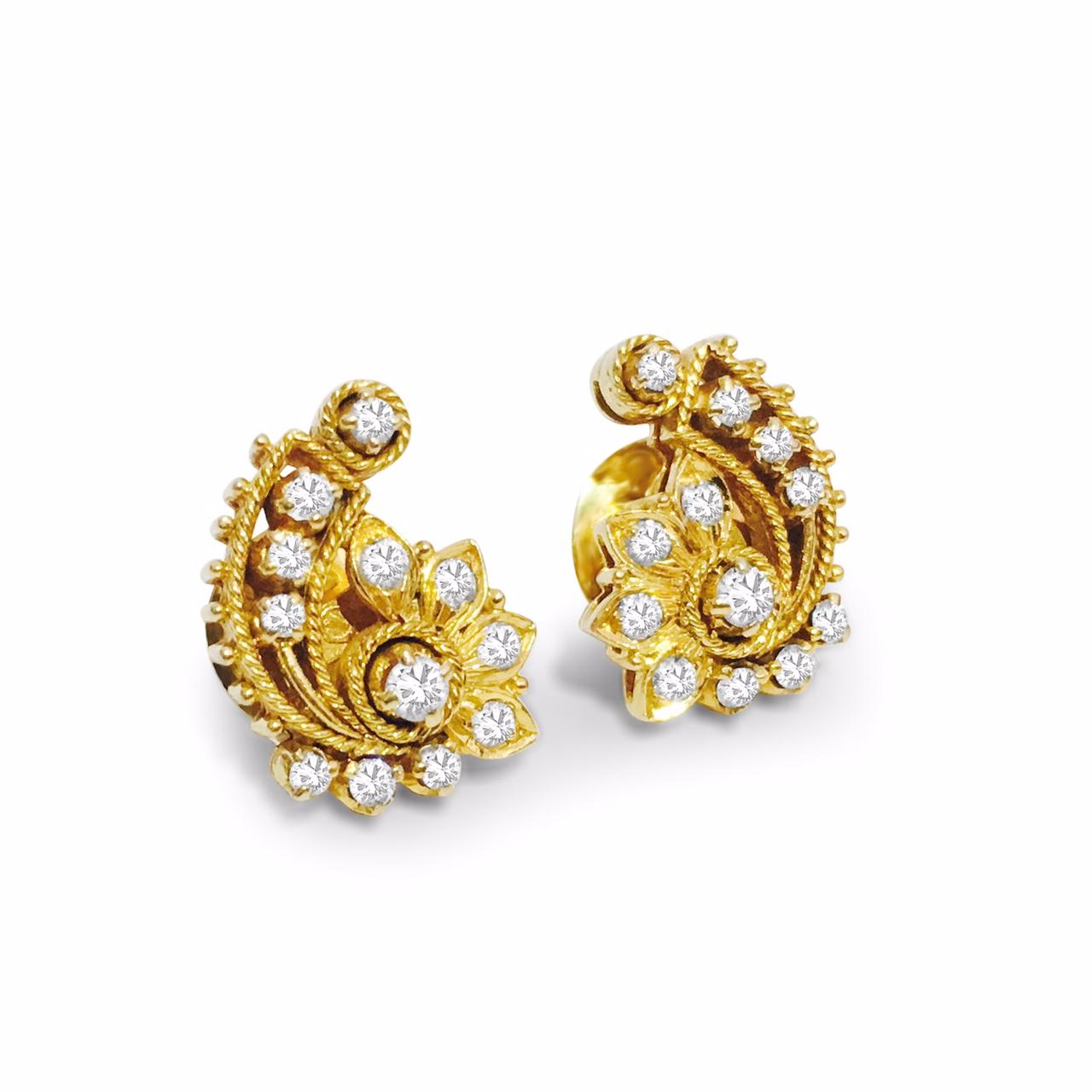 Fashioned from 18K yellow gold, these earrings feature 1.14 carats of round brilliant cut diamonds with VS clarity and F-G color. Their design exudes an elegant Asian/Indian style, adding a touch of sophistication to any ensemble.

Key