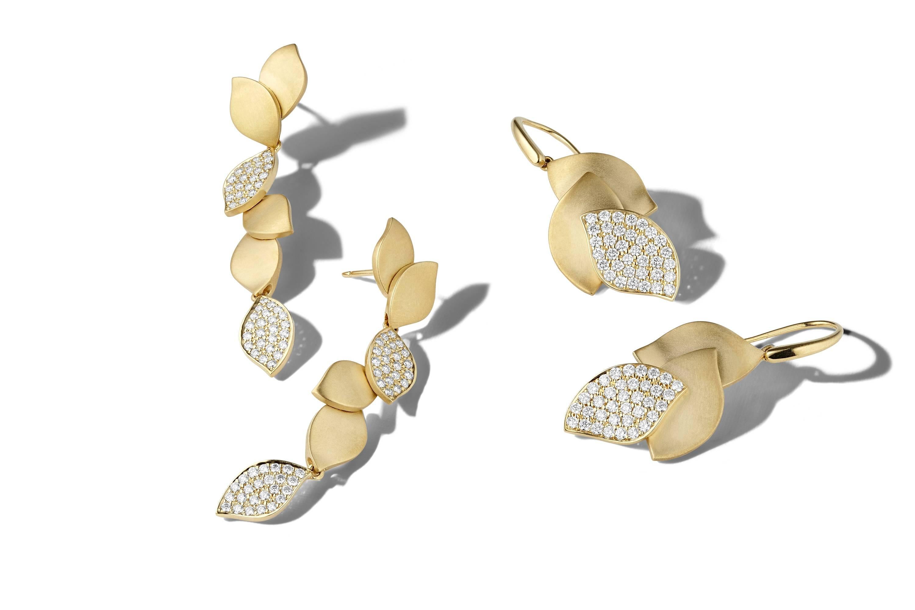 Cascading layers of 18 karat yellow gold leaves accented by 1.00 total carat of dazzling GH-VS round pave diamonds capture the alluring movement of nature to form these glamorous, undeniably unique earrings.  Stunning design allows the leaves to