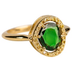 18 Karat Yellow Gold 1.03 Carat Tsavorite Garnet and Yellow Diamond Halo Ring