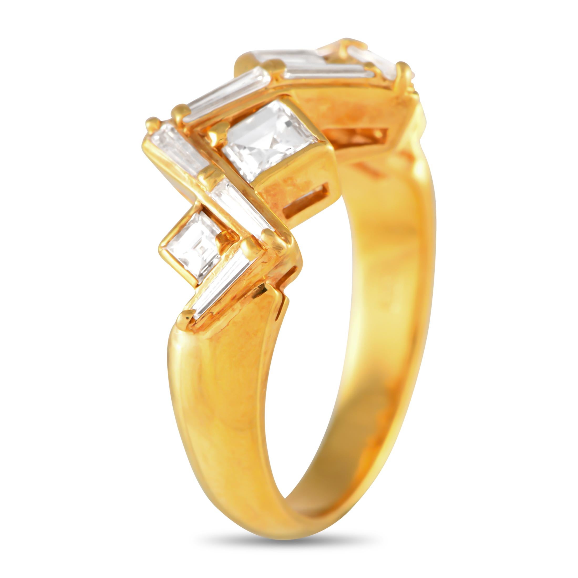 An exquisite arrangement of diamonds totaling 1.04 carats add visual impact to this rings striking 18K yellow gold setting. Ideal for any occasion, this piece features a 3mm wide band and a 5mm top height.This jewelry piece is offered in estate
