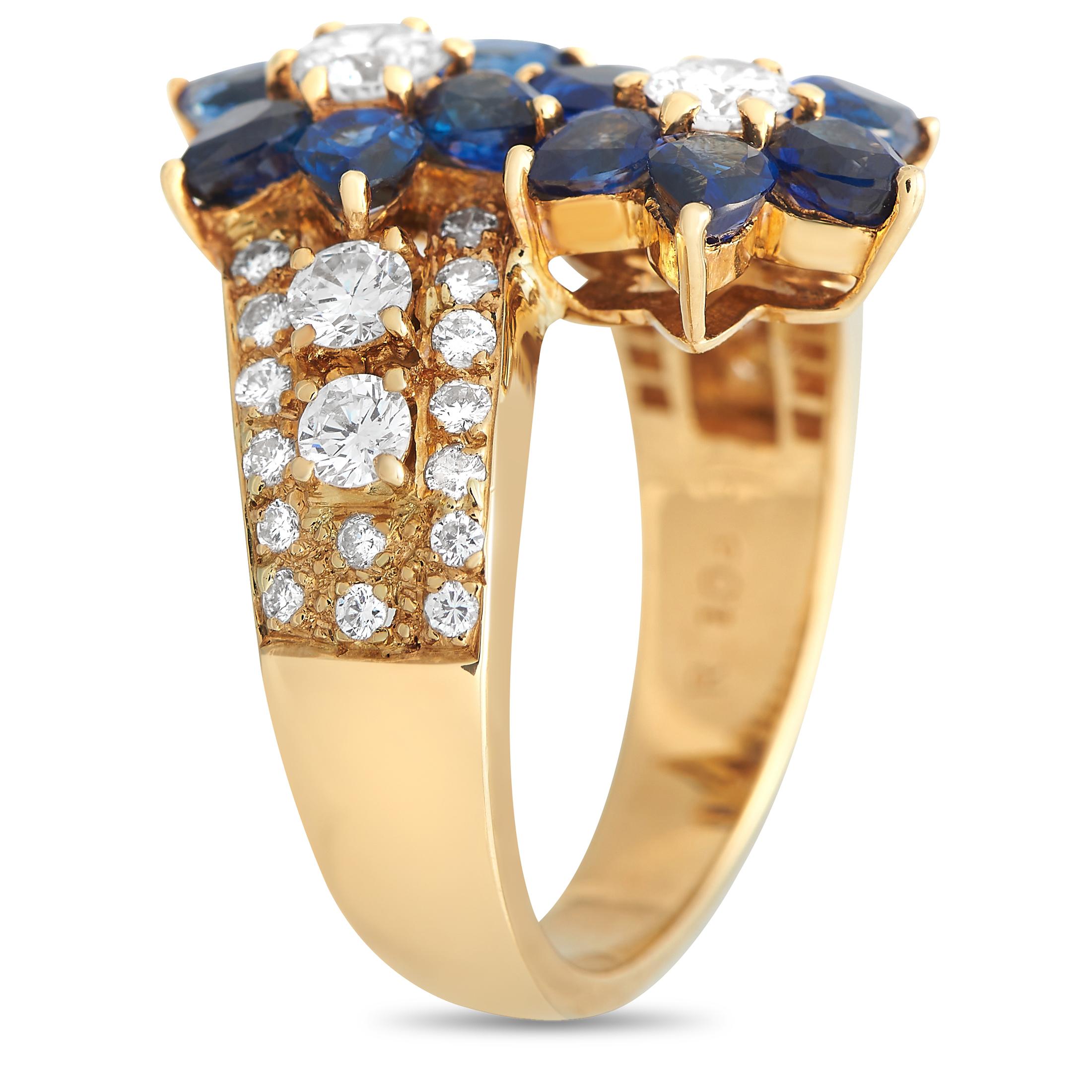 Twin floral motifs serve as a stunning focal point on this exquisite luxury ring. This elegant accessorys 18K Yellow Gold setting perfectly showcases sparkling Diamonds with a total weight of 1.08 carats and captivating blue Sapphire gemstones