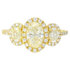 18k Yellow Gold 1.08ct Three-Stone Oval Diamond and 0.35ct Round Diamonds Ring