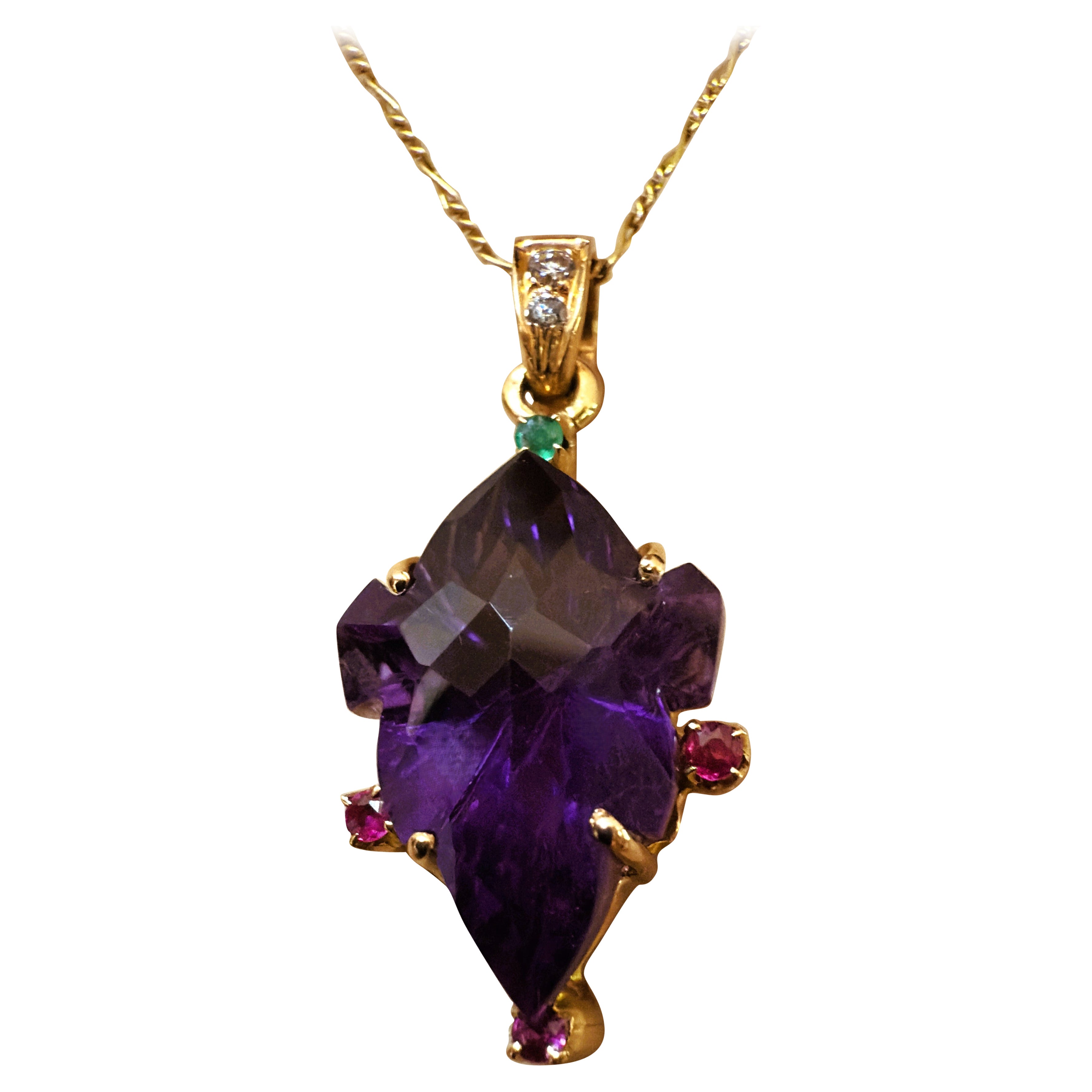 This pendant is just gorgeous!  It is pre-owned but in new condition.  It was very well cared for.  The cut of the stone is just magnificent.  The base cut of the amethyst is pear cut and then it is handcrafted with a geometric pattern.  It is a