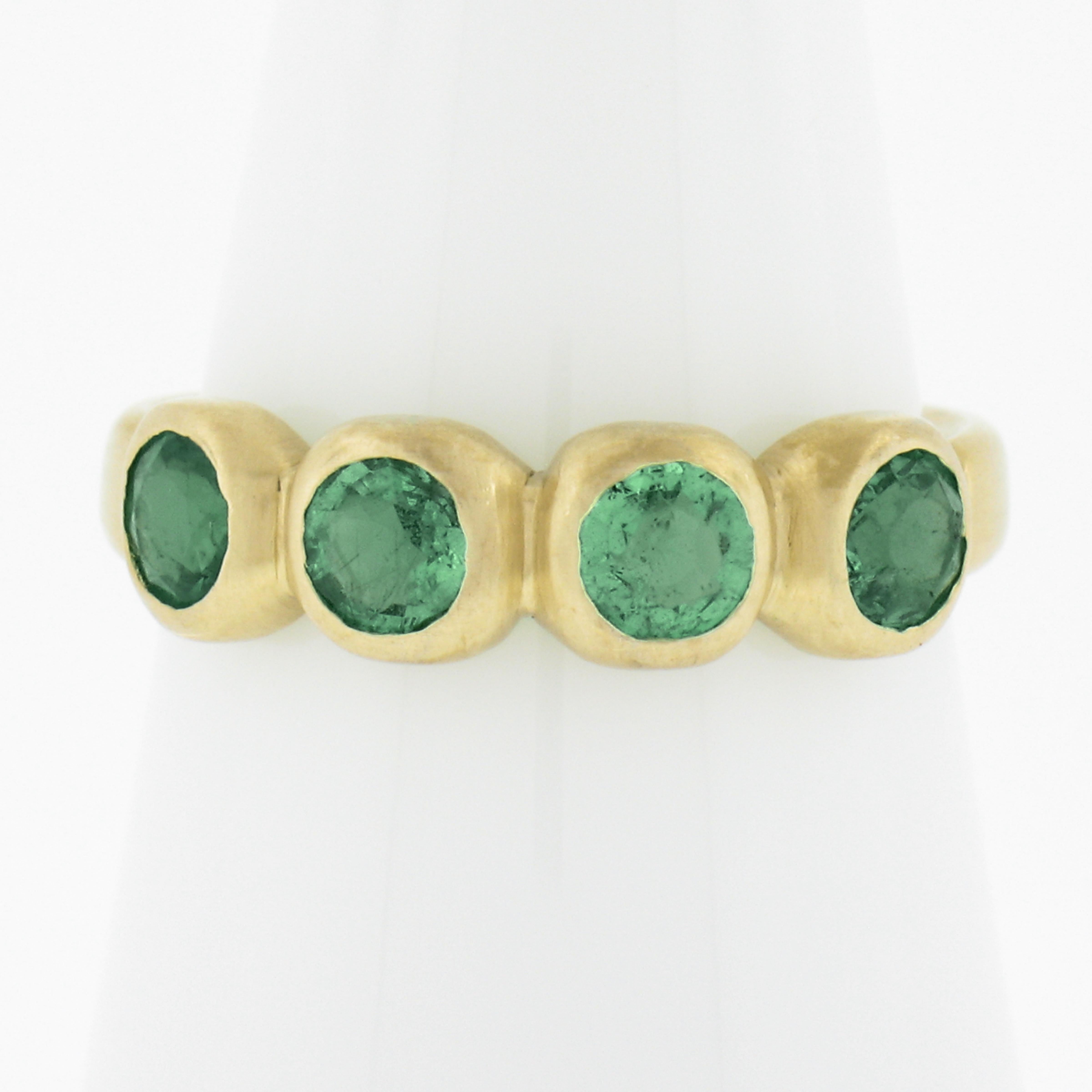 --Stone(s):--
(4) Natural Genuine Emeralds - Round Brilliant Cut - Bezel Set - Light To Medium Green Color 
Total Carat Weight:	1.0-1.20 (approx.)

Material: Solid 18K Yellow Gold
Weight: 3.85 Grams
Ring Size: 7.0 (Fitted on a finger. We can custom