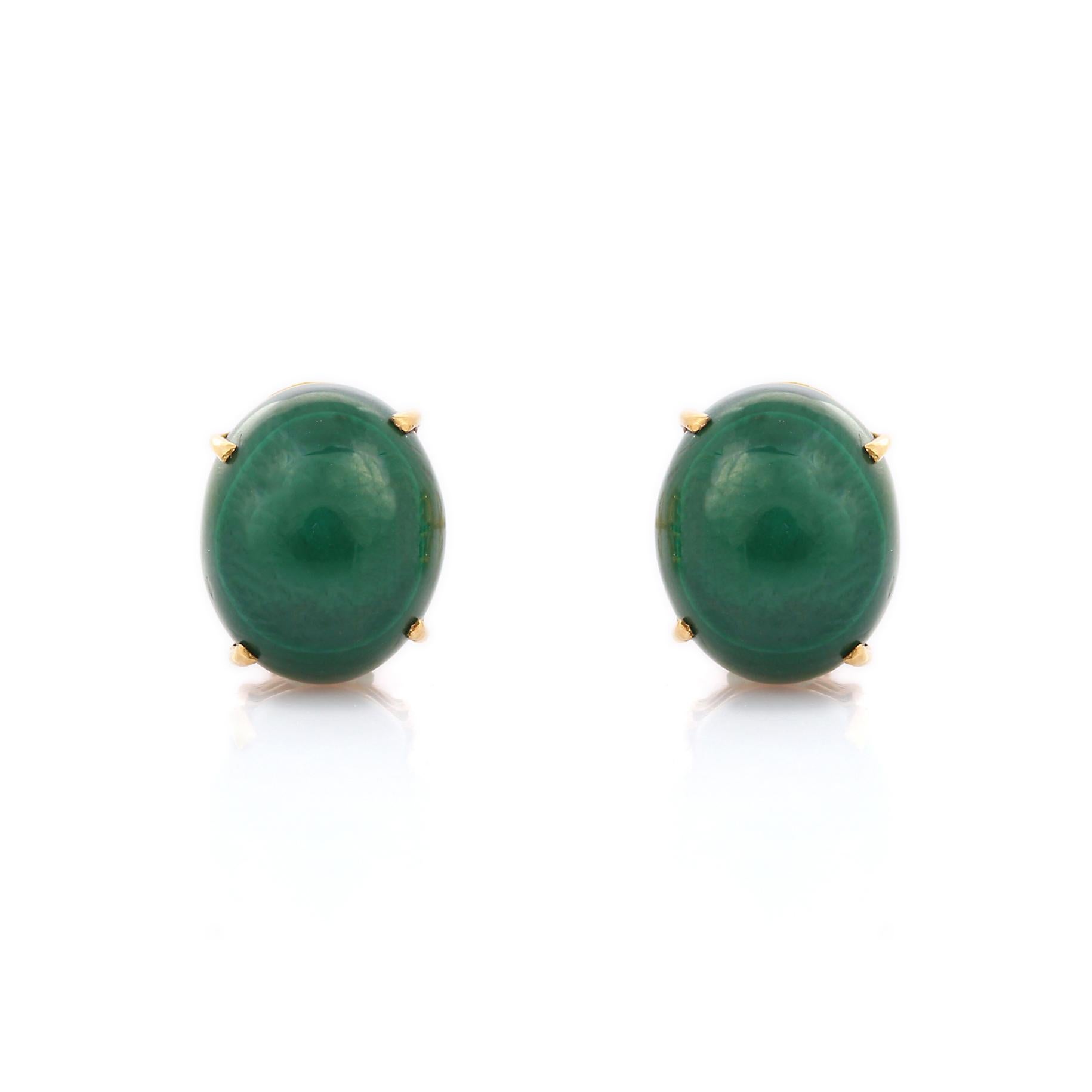 Earrings create a subtle beauty while showcasing the colors of the natural precious gemstones and illuminating diamonds making a statement.

Oval cut Malachite Stud earrings in 18K gold. Embrace your look with these stunning pair of earrings