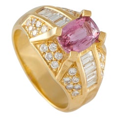 Bague en or jaune 18K sertie d'un diamant de 1,28ct et d'un saphir rose MF06-070125