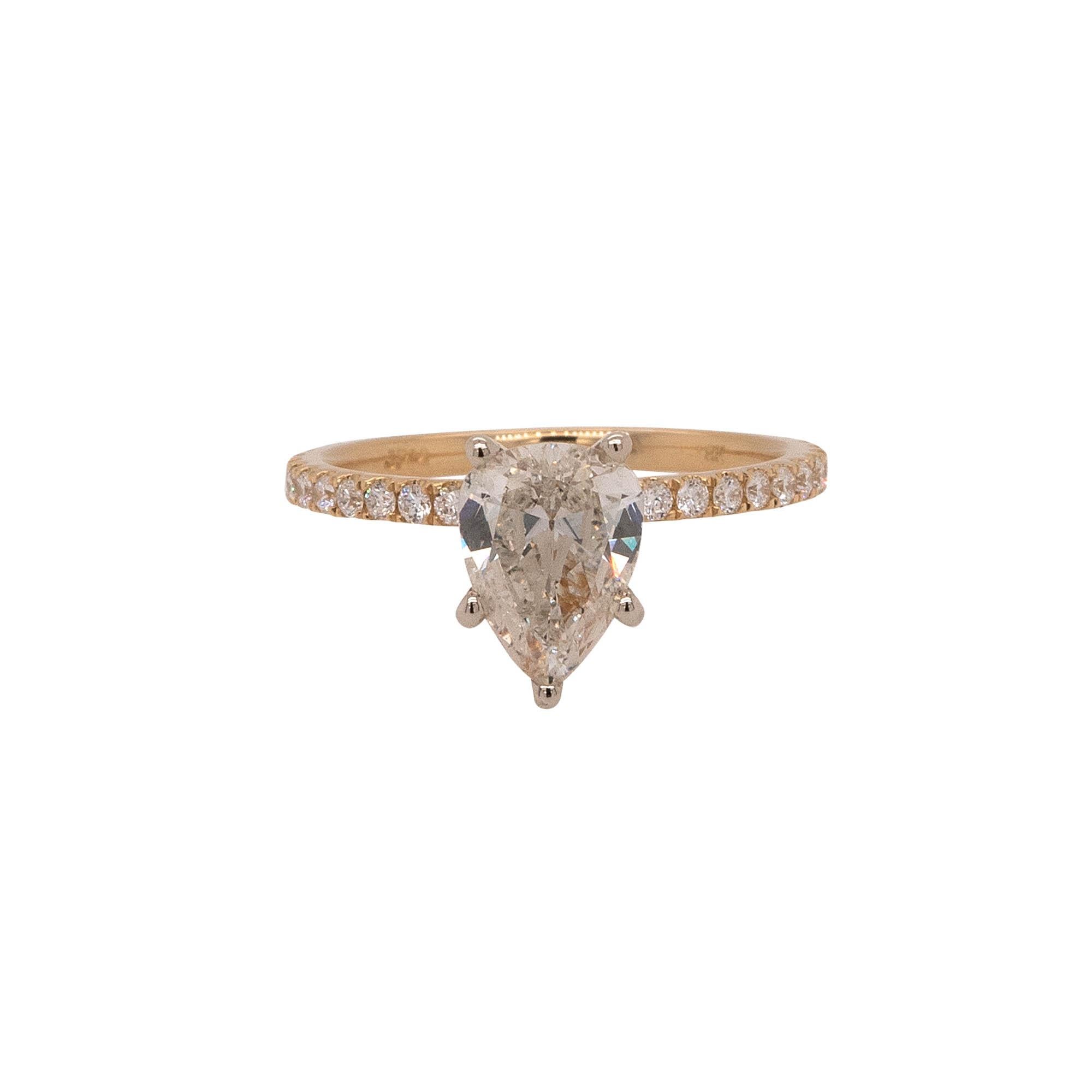 Center Details: 1.39ct Pear shape natural Diamond that is J in color and SI2 in clarity
Ring Material: 18k yellow gold
Ring Details: yellow gold ring that is paved with approximately 0.38ctw of round cut natural diamonds that are G/H in color and VS