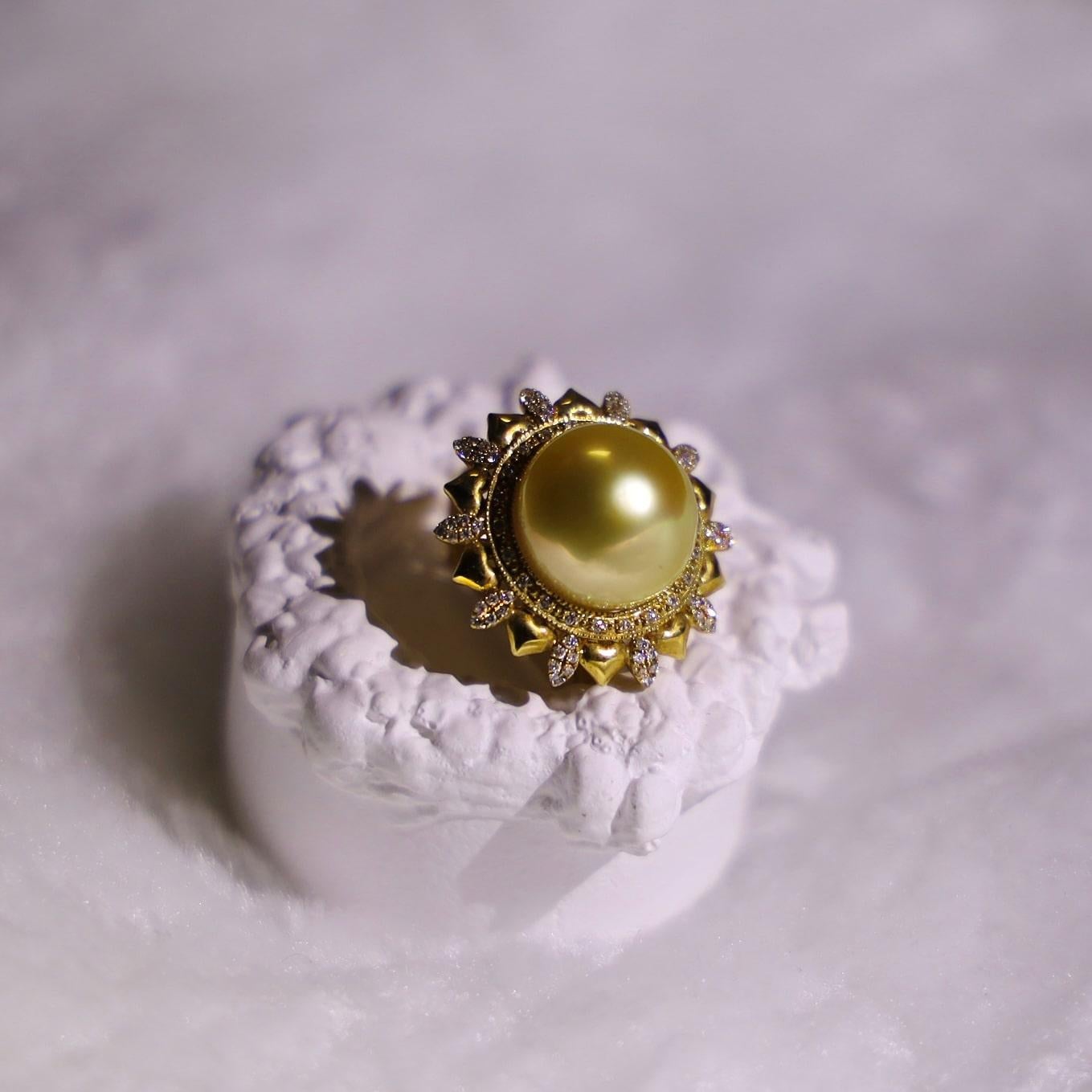 18K Yellow Gold 13mm South Sea Pearl Golden Pearl Ring with Diamonds

1 Golden South Sea Pearl - 13mm
82 Diamonds - 0.25 CT
Total Weight: 7.84 GM

This exquisite ring showcases the captivating allure of a 13mm South Sea pearl, masterfully set in 18K