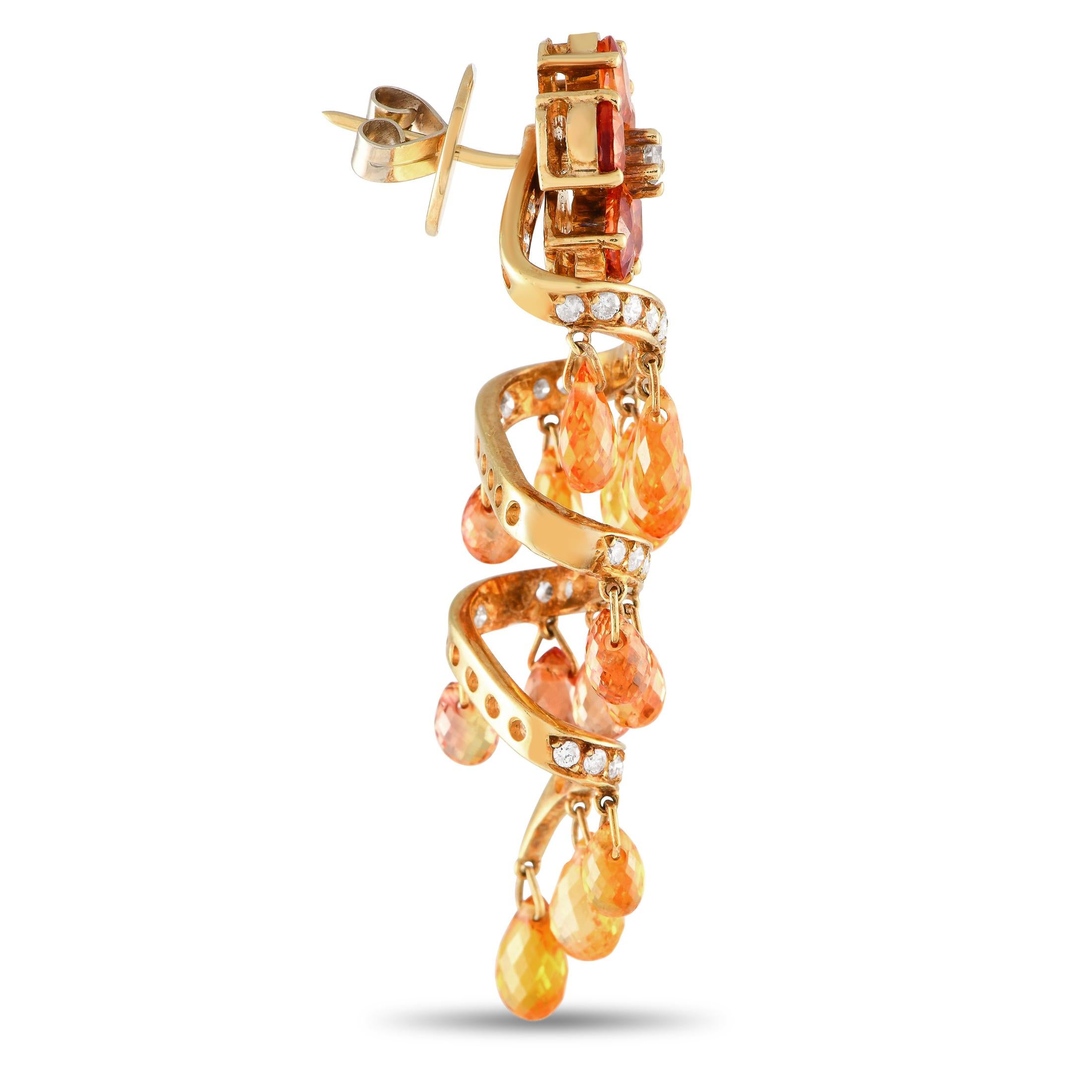 Let this pair of 18K yellow gold chandelier earrings add an extra classy touch to your stylish evening dress. Each earring is designed with a floral post composed of a diamond center and five citrine petals. Connected to it is a diamond-encrusted